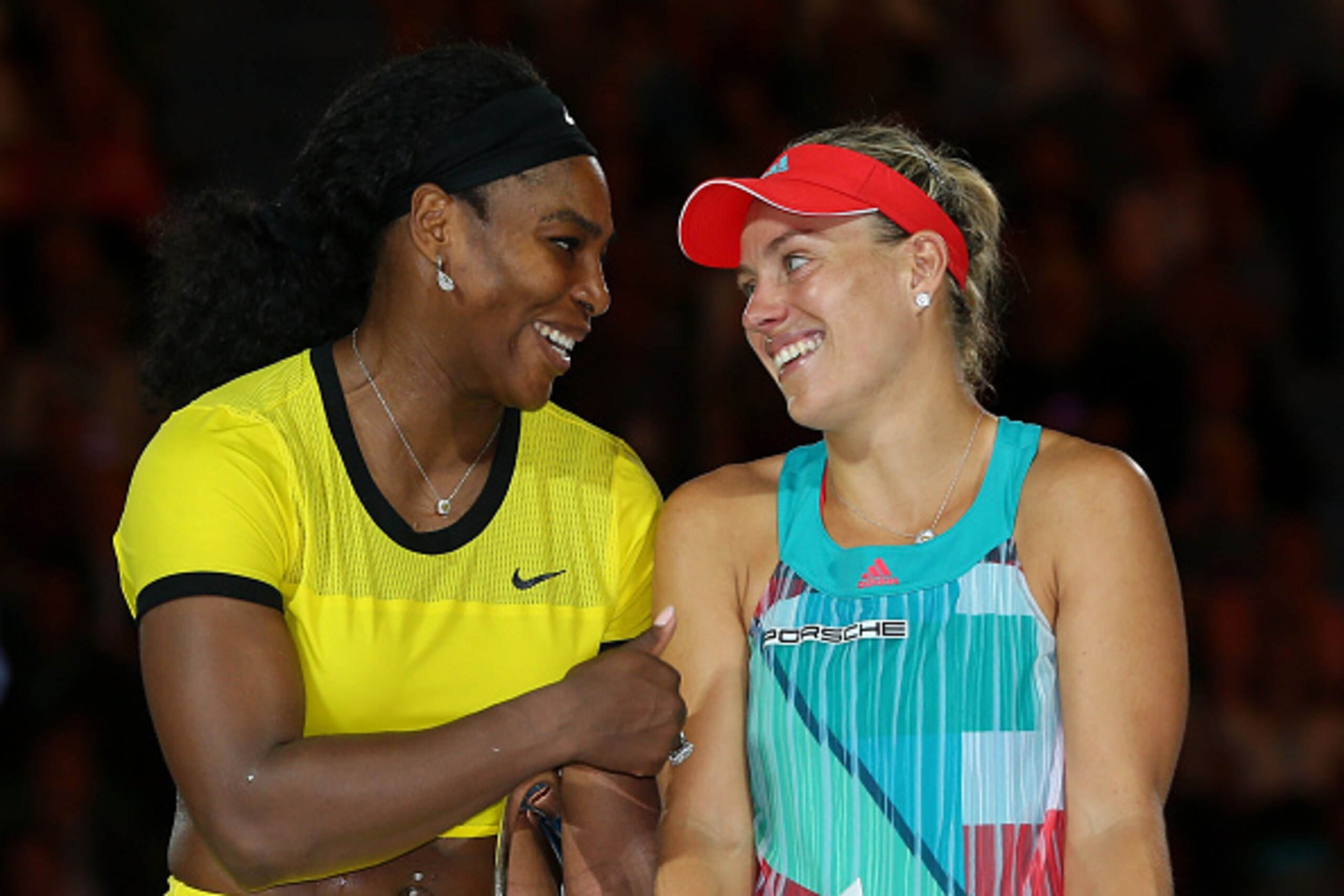 MELBOURNE, AUSTRALIA - JANUARY 30: (L-R) Serena Williams of the United States and winner Angelique Kerber of Germany stand on stage during the trophy presentation following the Women's Singles Final on day 13 of the 2016 Australian Open at Melbourne Park 