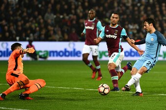 LONDON, ENGLAND - JANUARY 06:  David Silva of Manchester City scores his sides third goal during The Emirates FA Cup Third Round match between West Ham United and Manchester City at London Stadium on January 6, 2017 in London, England.  (Photo by Dan Mull