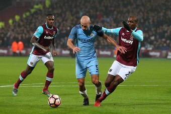 LONDON, ENGLAND - JANUARY 06: Angelo Ogbonna of West Ham fouls Pablo Zabaleta of Manchester City leading to a penalty during the Emirates FA Cup Third Round match between West Ham United and Manchester City at London Stadium on January 6, 2017 in London, 