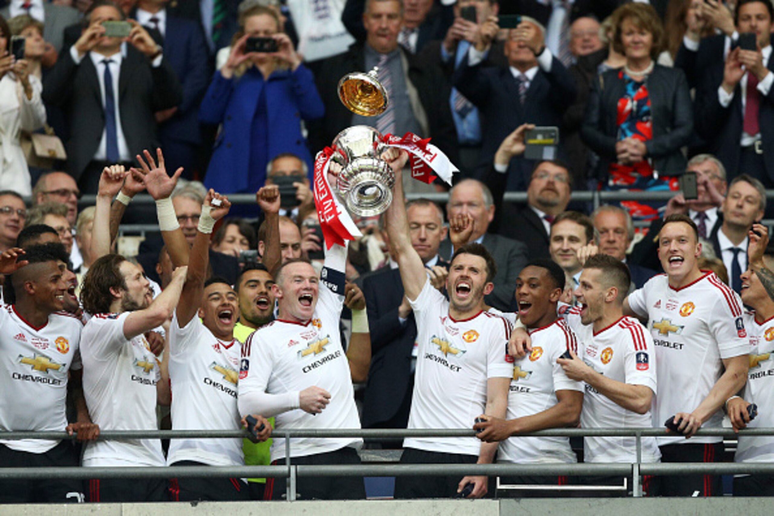 LONDON, ENGLAND - MAY 21: Wayne Rooney and Michael Carrick of Manchester United lift the trophy after winning The Emirates FA Cup Final match between Manchester United and Crystal Palace at Wembley Stadium on May 21, 2016 in London, England. (Photo by P LONDON, ENGLAND - MAY 21: Wayne Rooney and Michael Carrick of Manchester United lift the trophy after winning The Emirates FA Cup Final match between Manchester United and Crystal Palace at Wembley Stadium on May 21, 2016 in London, England. (Photo by P