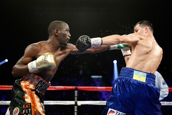 LAS VEGAS, NV - JULY 23:  WBO junior welterweight champion Terence Crawford (L) punches WBC champion Viktor Postol of Ukraine during their unification fight at MGM Grand Garden Arena on July 23, 2016 in Las Vegas, Nevada. Crawford won by unanimous decisio