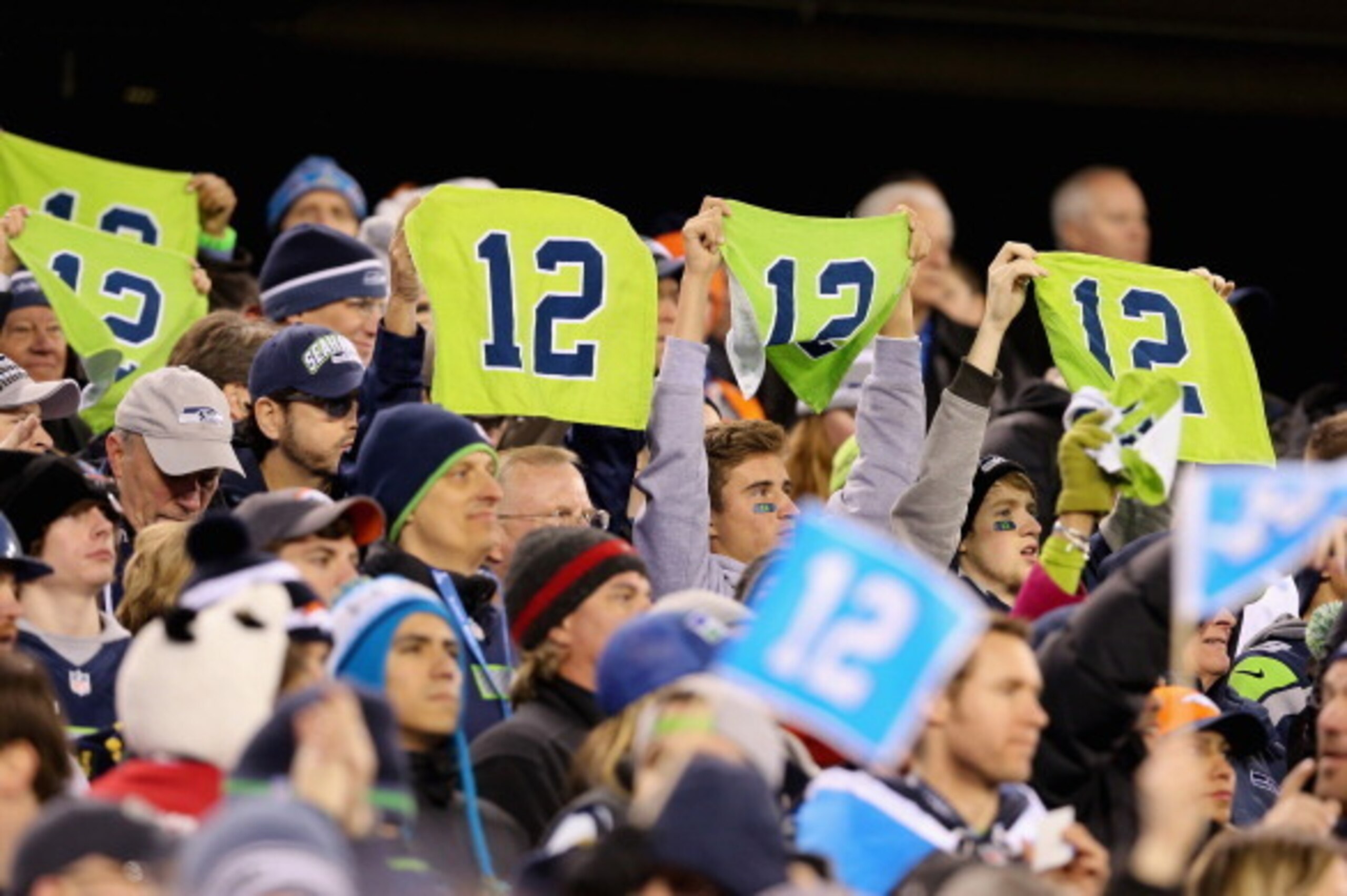 EAST RUTHERFORD, NJ - FEBRUARY 02: Seattle fans holds up 12th Man towels during Super Bowl XLVIII between the Denver Broncos and the Seattle Seahawks at MetLife Stadium on February 2, 2014 in East Rutherford, New Jersey.  (Photo by Christian Petersen/Gett