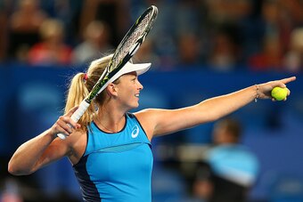 PERTH, AUSTRALIA - JANUARY 07:  Coco Vandeweghe of the United States looks to hit signed balls into the crowd after winning the women's singles match against Kristina Mladenovic of France during the 2017 Hopman Cup Final at Perth Arena on January 7, 2017 