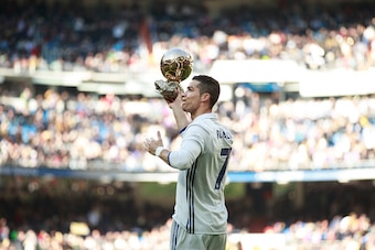 MADRID, SPAIN - JANUARY 07: Cristiano Ronaldo of Real Madrid CF shows his fourth Golden Ball to the audience prior to start the La Liga match between Real Madrid CF and Granada CF at Estadio Santiago Bernabeu on January 7, 2017 in Madrid, Spain.  (Photo b