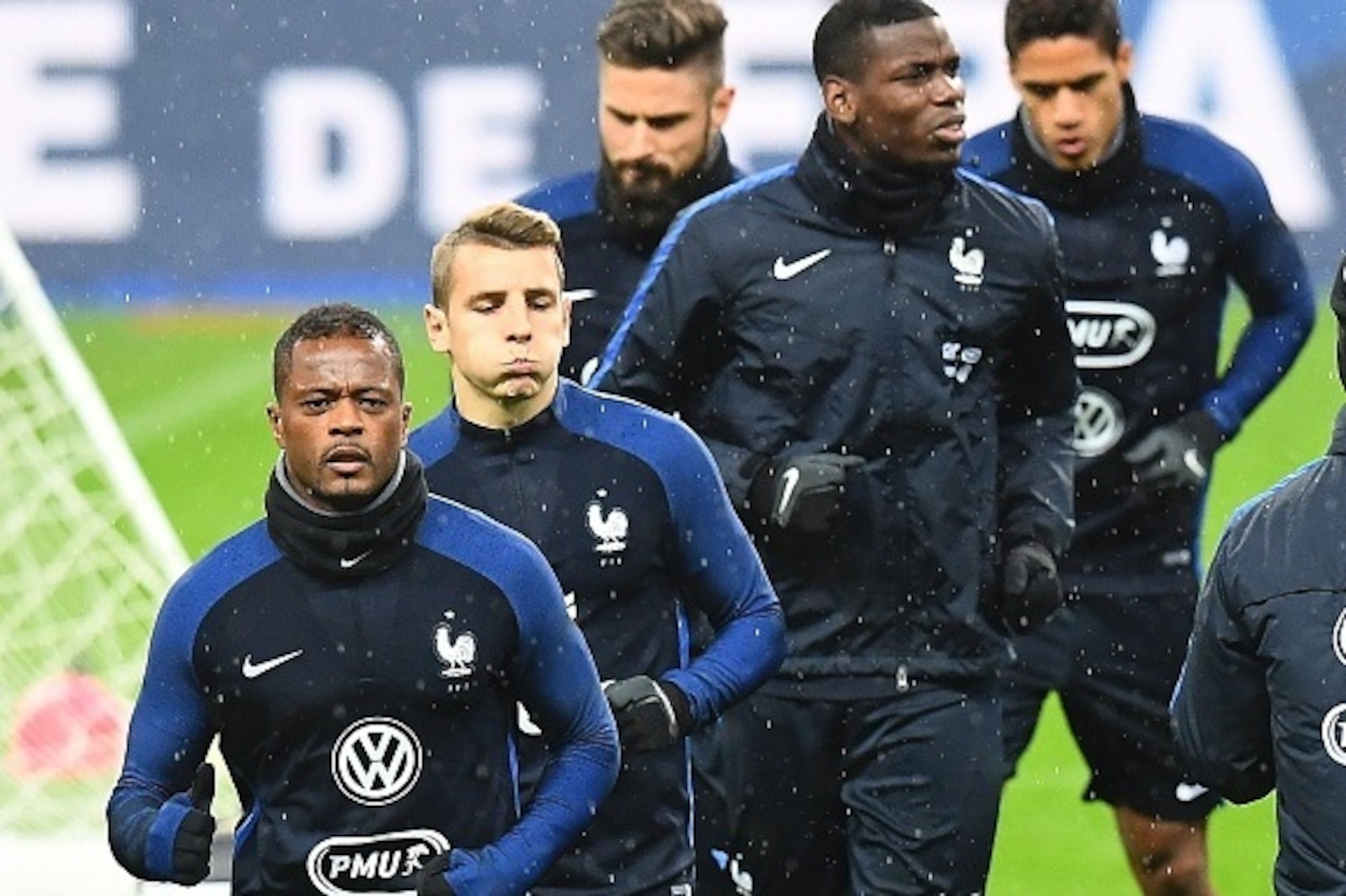 (From L) France's defender Patrice Evra, France's defender Lucas Digne and France's midfielder Paul Pogba (2ndR) attend a training session at the Stade de France stadium in Saint-Denis, north of Paris, on November 10, 2016, on the eve of the FIFA World Cu