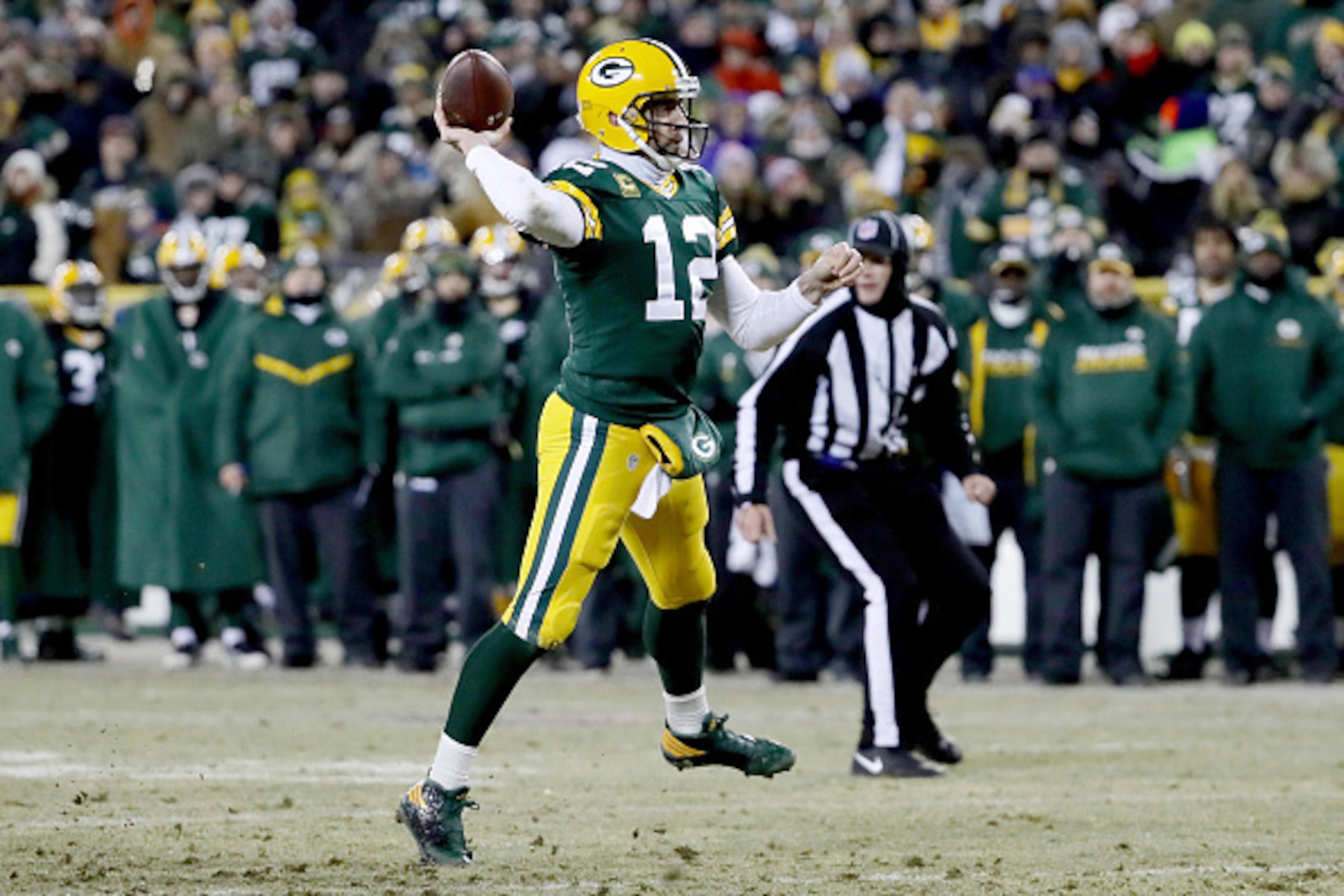 GREEN BAY, WI - JANUARY 8:  Aaron Rodgers #12 of the Green Bay Packers throws a pass in the second quarter during the NFC Wild Card game against the New York Giants at Lambeau Field on January 8, 2017 in Green Bay, Wisconsin. (Photo by Jonathan Daniel/Get