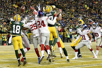 GREEN BAY, WI - JANUARY 08:  Randall Cobb #18 of the Green Bay Packers catches a touchdown pass in the second quarter during the NFC Wild Card game against the New York Giants at Lambeau Field on January 8, 2017 in Green Bay, Wisconsin.  (Photo by Stacy R