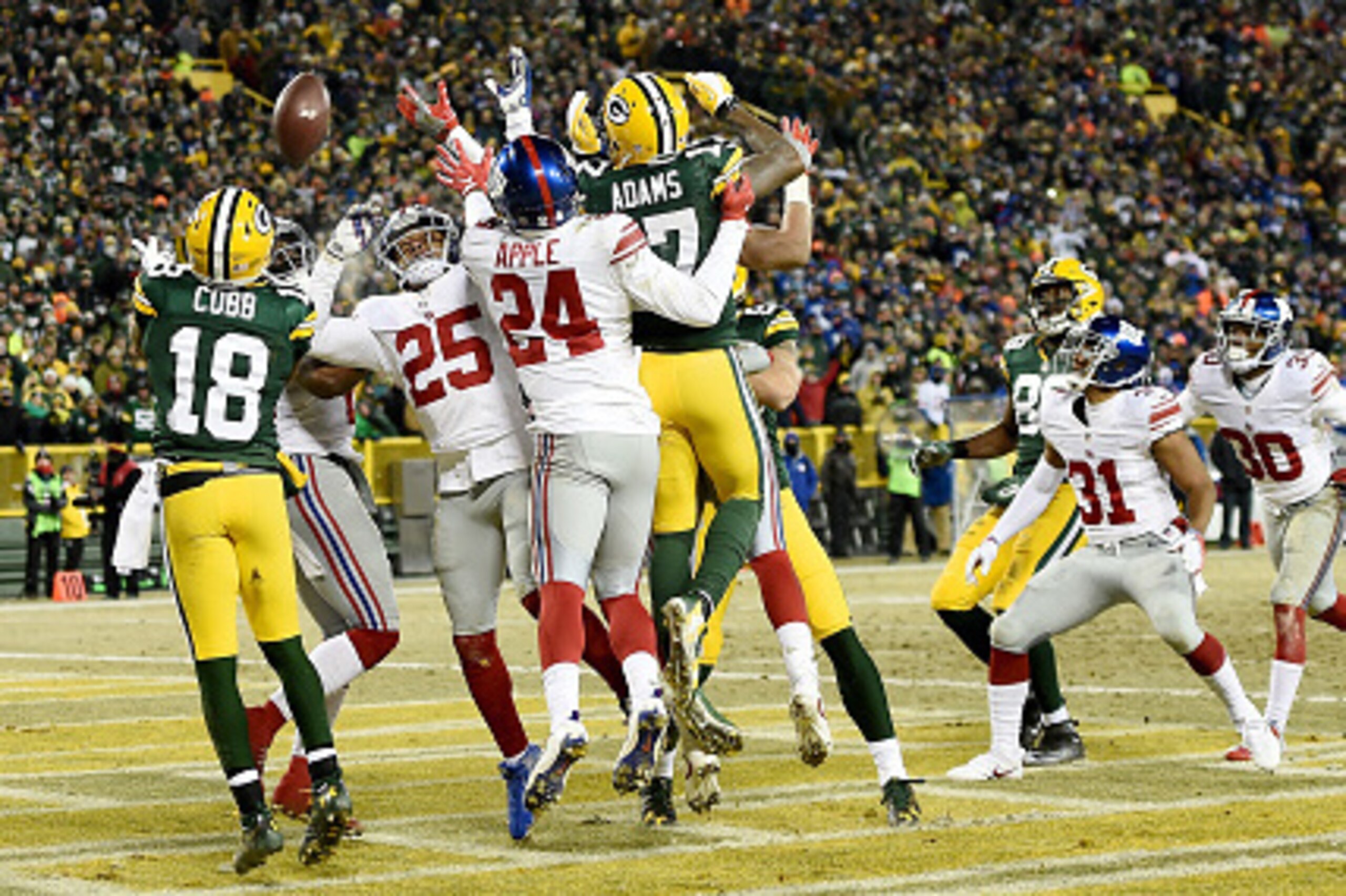GREEN BAY, WI - JANUARY 08:  Randall Cobb #18 of the Green Bay Packers catches a touchdown pass in the second quarter during the NFC Wild Card game against the New York Giants at Lambeau Field on January 8, 2017 in Green Bay, Wisconsin.  (Photo by Stacy R