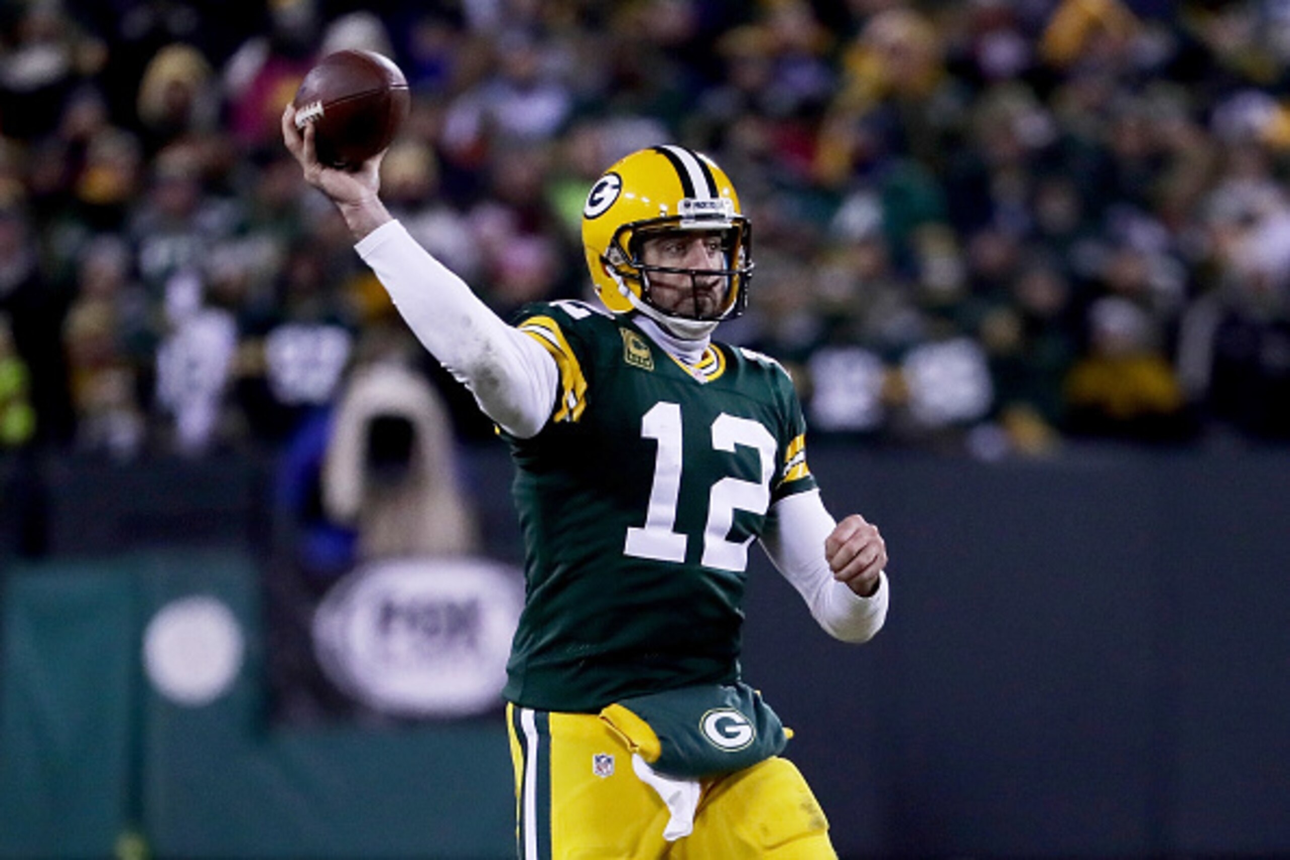 GREEN BAY, WI - JANUARY 8:  Aaron Rodgers #12 of the Green Bay Packers throws a pass in the fourth quarter during the NFC Wild Card game against the New York Giants at Lambeau Field on January 8, 2017 in Green Bay, Wisconsin. (Photo by Jonathan Daniel/Get