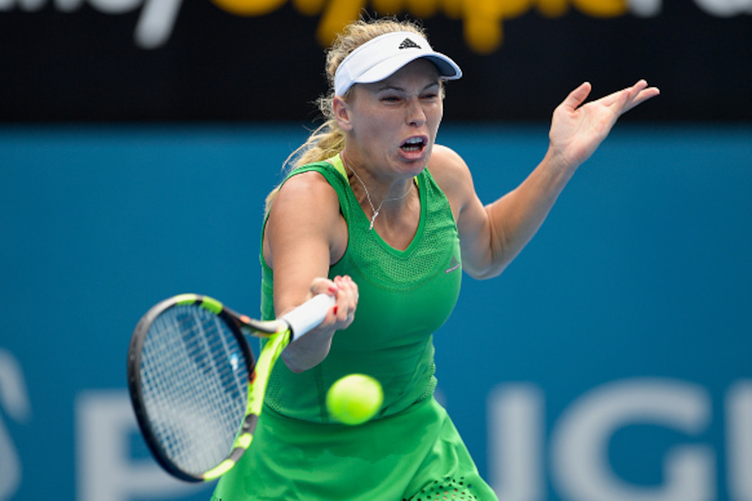 SYDNEY, AUSTRALIA - JANUARY 09: Caroline Wozniacki of Denmark plays a forehand shot in her first round match against Monica Puig of Puerto Rico during day two of the 2017 Sydney International at Sydney Olympic Park Tennis Centre on January 9, 2017 in Syd SYDNEY, AUSTRALIA - JANUARY 09: Caroline Wozniacki of Denmark plays a forehand shot in her first round match against Monica Puig of Puerto Rico during day two of the 2017 Sydney International at Sydney Olympic Park Tennis Centre on January 9, 2017 in Syd
