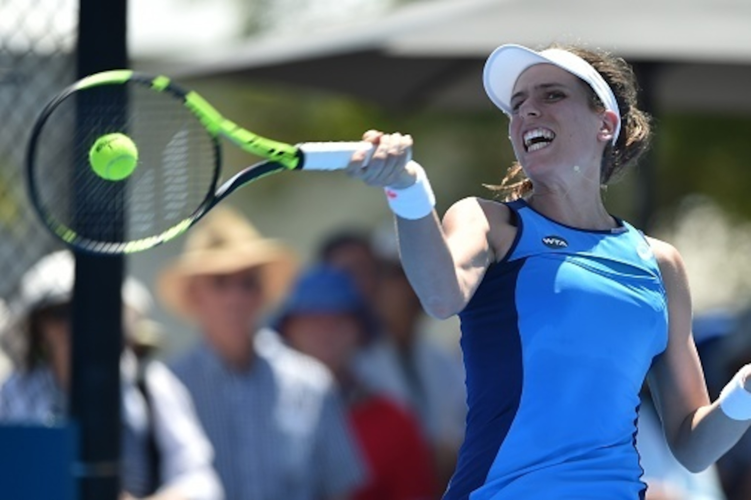 Johanna Konta of Britain hits a return to Arina Rodionova of Australia during their women's singles first round match at the Sydney International tennis tournament in Sydney on January 9, 2017. / AFP / PETER PARKS / IMAGE RESTRICTED TO EDITORIAL USE - STR Johanna Konta of Britain hits a return to Arina Rodionova of Australia during their women's singles first round match at the Sydney International tennis tournament in Sydney on January 9, 2017. / AFP / PETER PARKS / IMAGE RESTRICTED TO EDITORIAL USE - STR