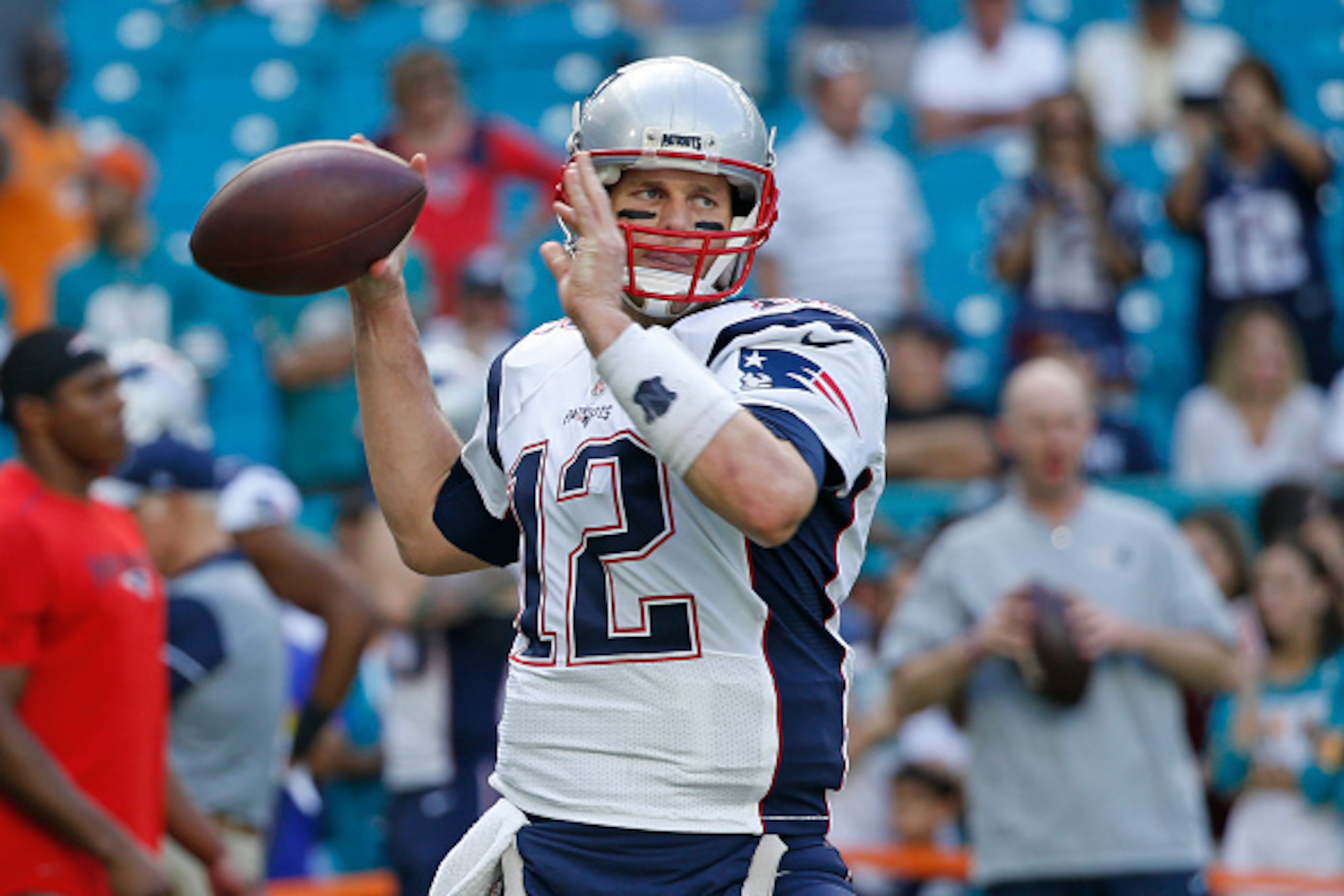 MIAMI GARDENS, FL - JANUARY 1: Tom Brady #12 of the New England Patriots throws the ball prior to the game against the Miami Dolphins on January 1, 2017 at Hard Rock Stadium in Miami Gardens, Florida. The Patriots defeated the Dolphins 35-14. (Photo by Jo