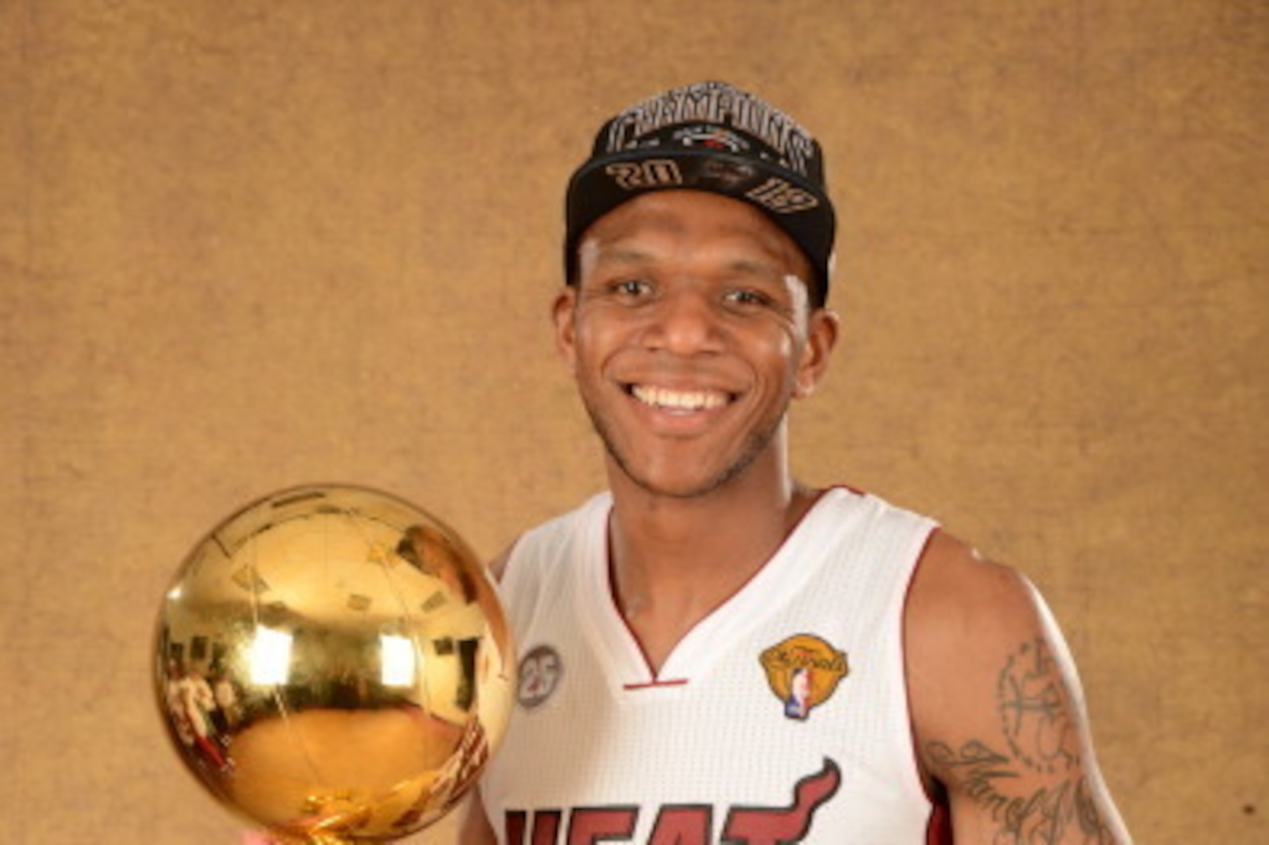MIAMI, FL - JUNE 20: James Jones #22 of the Miami Heat poses for a portrait with the Larry O'Brien Trophy after defeating the San Antonio Spurs in Game Seven of the 2013 NBA Finals on June 20, 2013 at American Airlines Arena in Miami, Florida. NOTE TO USE