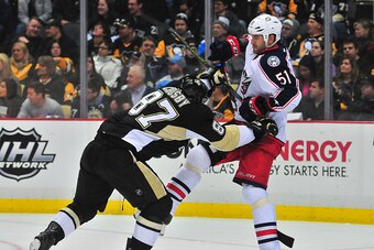 PITTSBURGH, PA - NOVEMBER 13: Sydney Crosby #87 of the Pittsburgh Penguins shoves Fedor Tyutin #51 of the Columbus Blue Jackets during the game at Consol Energy Center on November 13, 2015 in Pittsburgh, Pennsylvania. (Photo by Matt Kincaid/Getty Images)