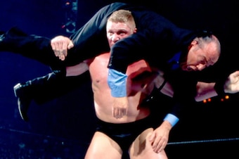 Brock Lesnar sets up Paul Heyman for an F-5.