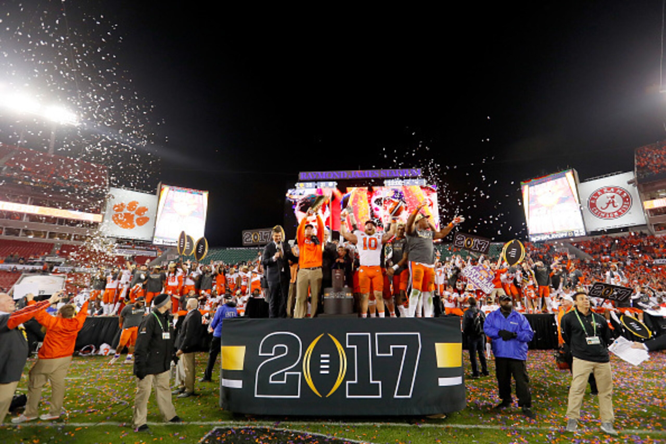 TAMPA, FL - JANUARY 09:  Head coach Dabo Swinney of the Clemson Tigers (L) and linebacker Ben Boulware #10 (C) celebrate after defeating the Alabama Crimson Tide 35-31 to win the 2017 College Football Playoff National Championship Game at Raymond James St