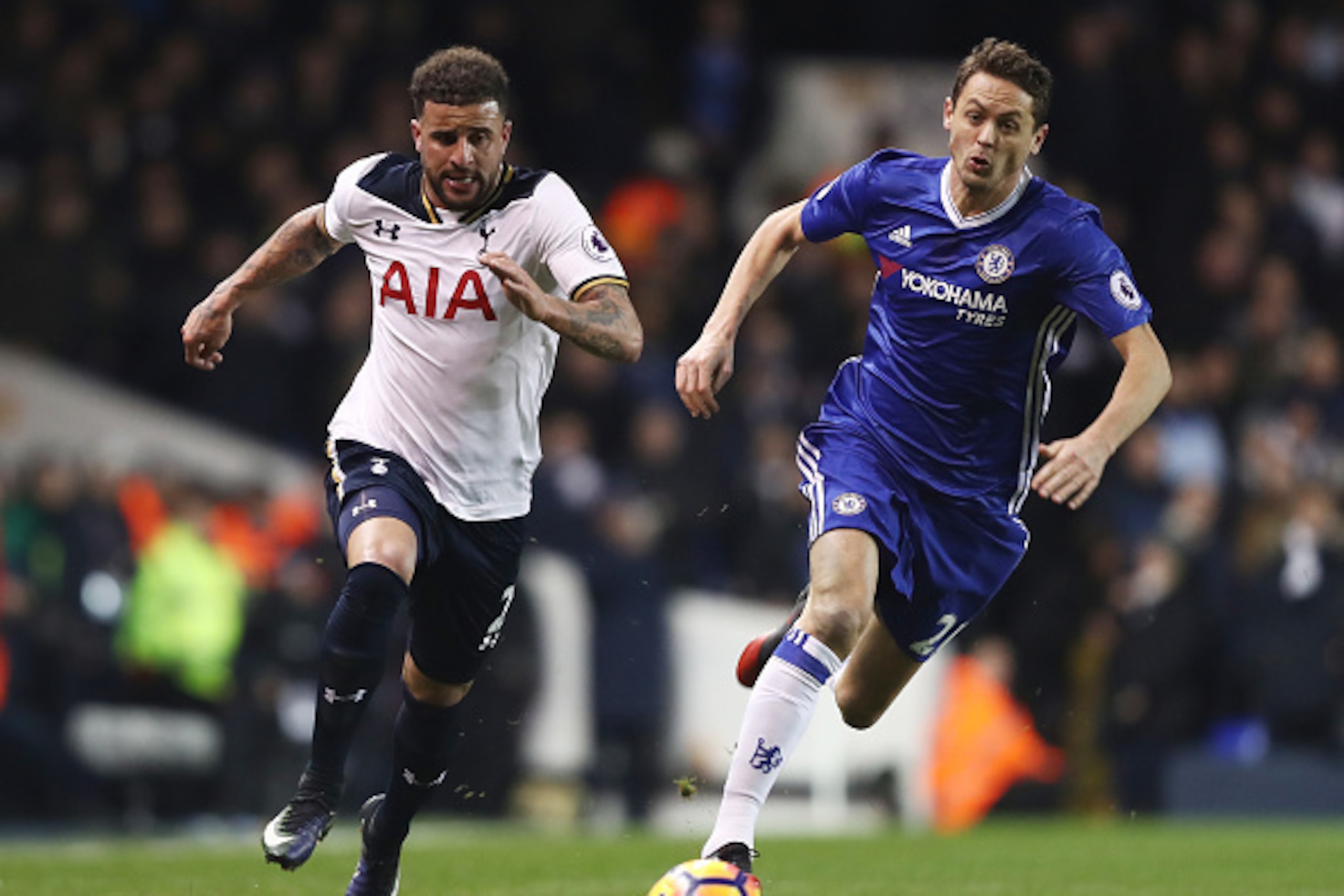 LONDON, ENGLAND - JANUARY 04:  Kyle Walker of Tottenham Hotspur (L) takes the ball past Nemanja Matic of Chelsea (R) during the Premier League match between Tottenham Hotspur and Chelsea at White Hart Lane on January 4, 2017 in London, England.  (Photo by