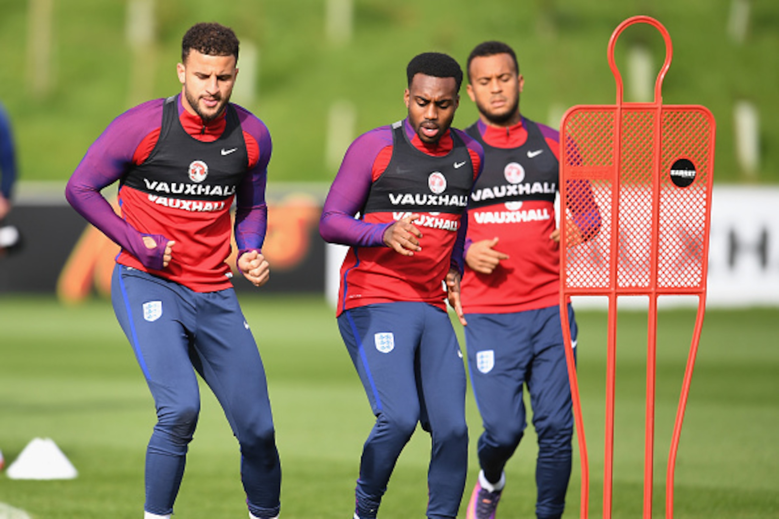 BURTON-UPON-TRENT, ENGLAND - OCTOBER 07: Kyle Walker of England (L) and Danny Rose of England (R) warm up  during an England training session ahead of the FIFA 2018 World Cup Group F Qualifier match against Malta at St Georges Park on October 7, 2016 in B