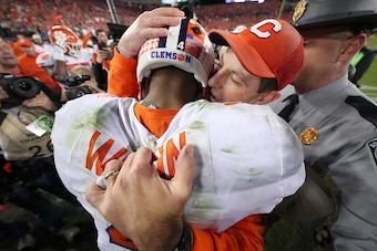 TAMPA, FL - JANUARY 09:  Quarterback Deshaun Watson #4 hugs head coach Dabo Swinney of the Clemson Tigers after defeating the Alabama Crimson Tide 35-31 to win the 2017 College Football Playoff National Championship Game at Raymond James Stadium on Januar