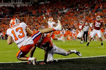 TAMPA, FL - JANUARY 09:  Wide receiver Hunter Renfrow #13 of the Clemson Tigers makes a 2-yard game-winning touchdown reception against defensive back Tony Brown #2 of the Alabama Crimson Tide during the fourth quarter of the 2017 College Football Playoff