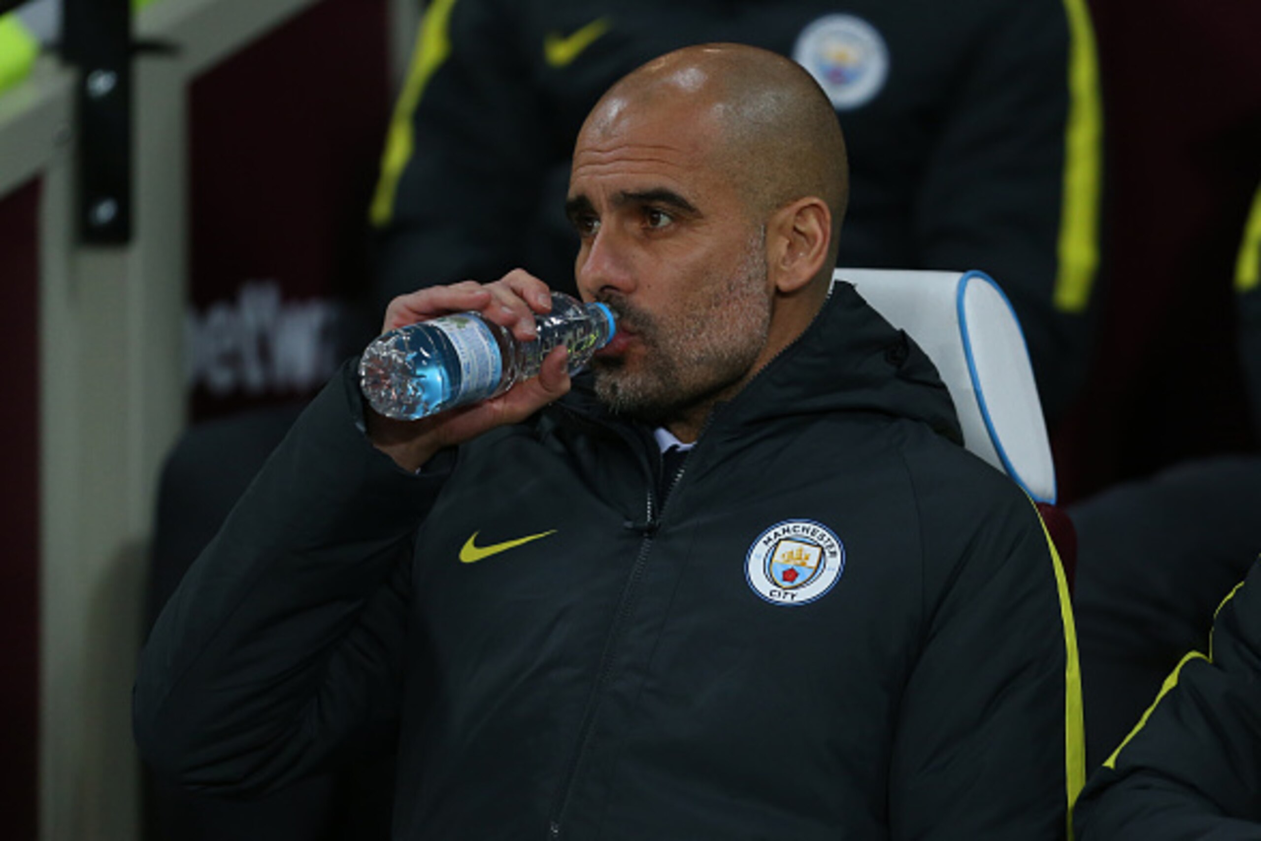 LONDON, ENGLAND - JANUARY 06: Pep Guardiola the head coach / manager of Manchester City has a drink
during the Emirates FA Cup Third Round match between West Ham United and Manchester City at London Stadium on January 6, 2017 in London, England. (Photo by