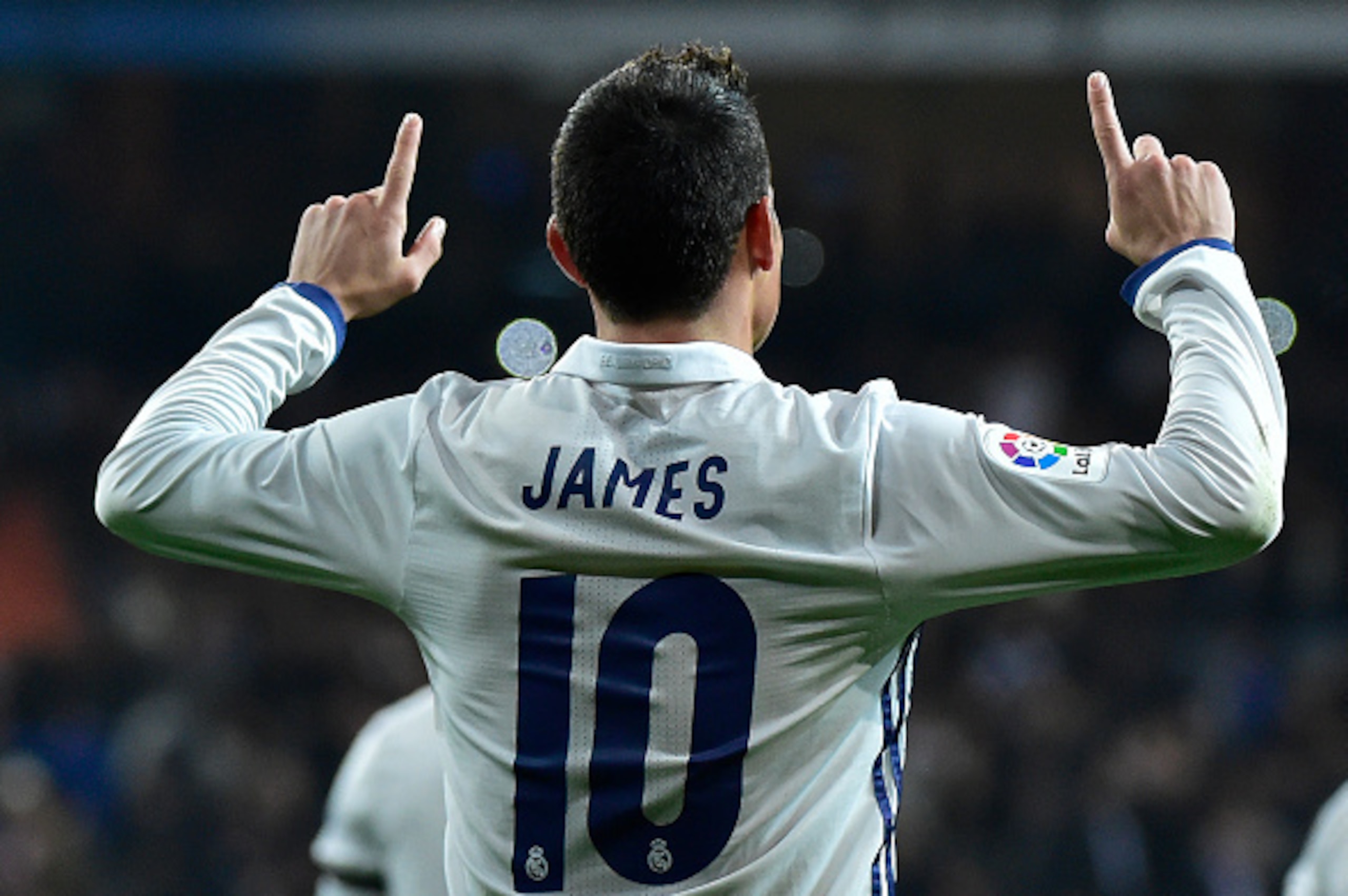 TOPSHOT - Real Madrid's Colombian midfielder James Rodriguez celebrates after scoring on a penalty kick during the Spanish Copa del Rey (King's Cup) round of 16 first leg football match Real Madrid CF vs Sevilla FC at the Santiago Bernabeu stadium in Madr