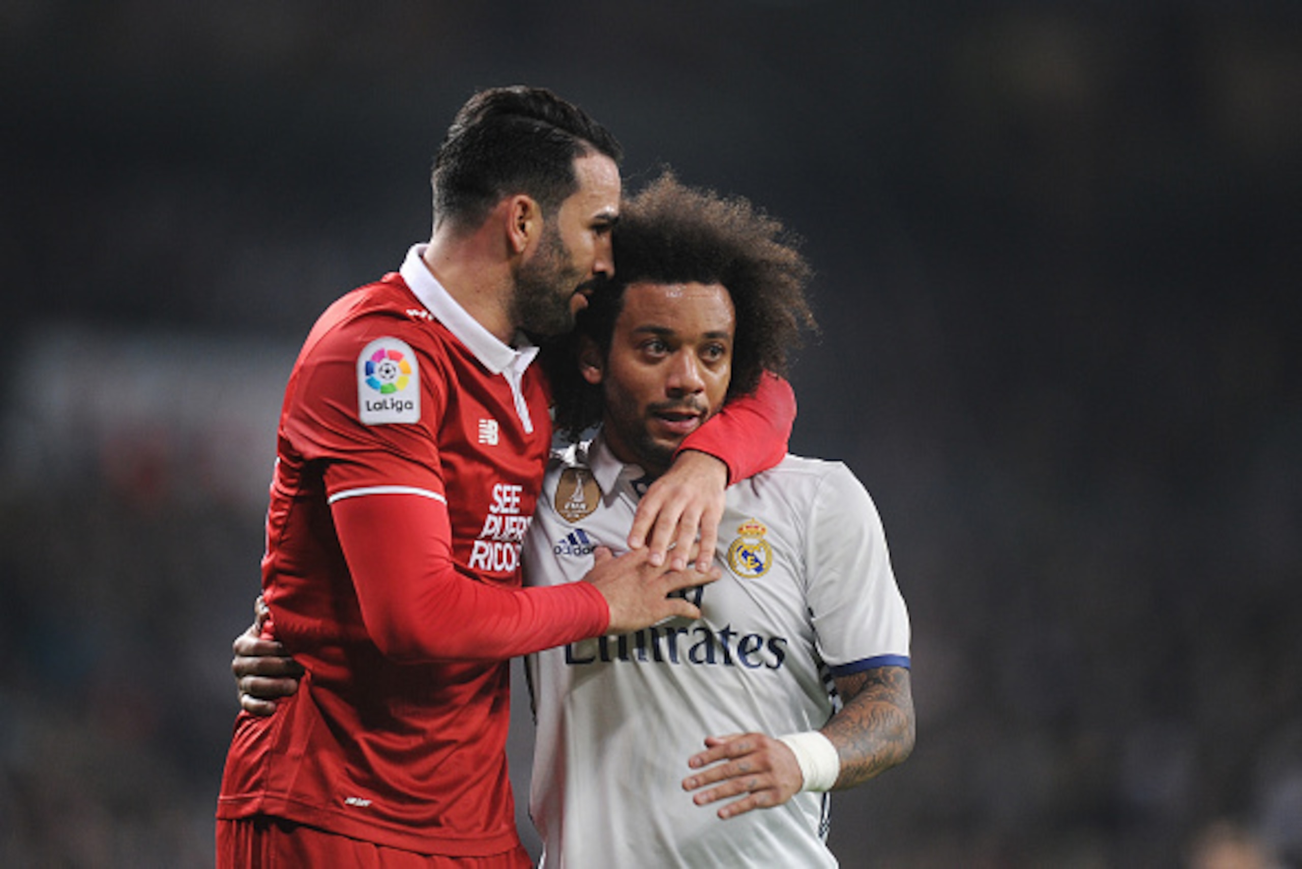 MADRID, SPAIN - JANUARY 04:  Adil Rami of Sevilla FC reacts with Marcelo of Real Madrid after he stopped Marcelo's attack during the Copa del Rey Round of 16 First Leg match between Real Madrid and Sevilla  at Bernabeu on January 4, 2017 in Madrid, Spain.