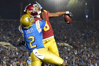 PASADENA, CA - NOVEMBER 19:  Defensive back Iman Marshall #8 of the USC Trojans breaks up a pass to wide receiver Jordan Lasley #2 of the UCLA Bruins during the first quarter at Rose Bowl on November 19, 2016 in Pasadena, California.  (Photo by Harry How/