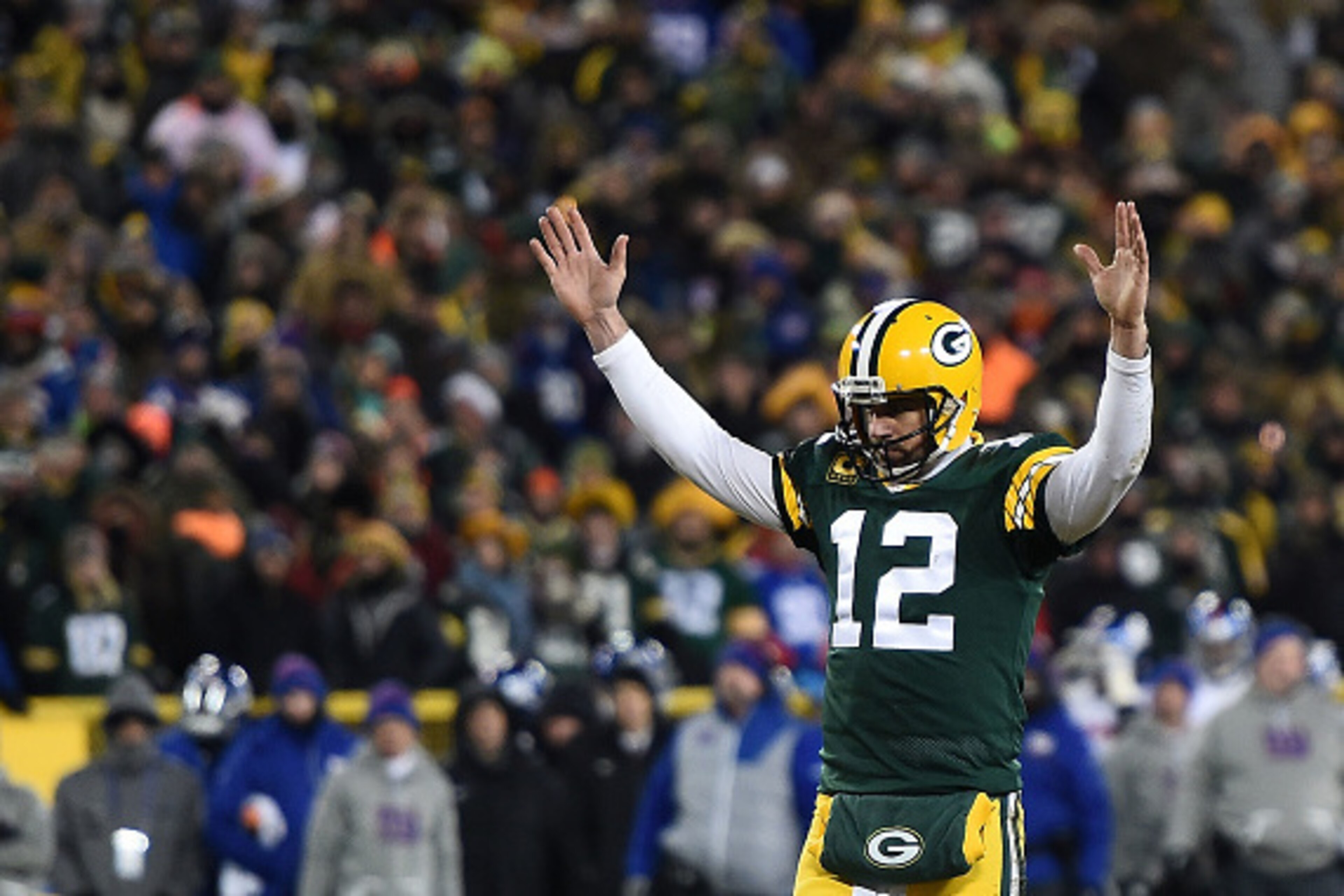 GREEN BAY, WI - JANUARY 08:  Aaron Rodgers #12 of the Green Bay Packers reacts to a score against the New York Giants during the NFC Wild Card game at Lambeau Field on January 8, 2017 in Green Bay, Wisconsin.  The Packers defeated the Giants 38-13.  (Phot