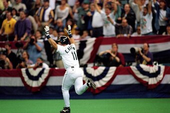 SEATTLE - OCTOBER 7:  Edgar Martinez #11 of the Seattle Mariners hits a three-run home run in the third inning of Game four of the 1995 American League Divisional Series against the New York Yankees at the Kingdome on October 7, 1995 in Seattle, Washingto