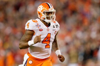 TAMPA, FL - JANUARY 09:  Quarterback Deshaun Watson #4 of the Clemson Tigers celebrates after throwing a 24-yard touchdown pass during the third quarter against the Alabama Crimson Tide in the 2017 College Football Playoff National Championship Game at Ra