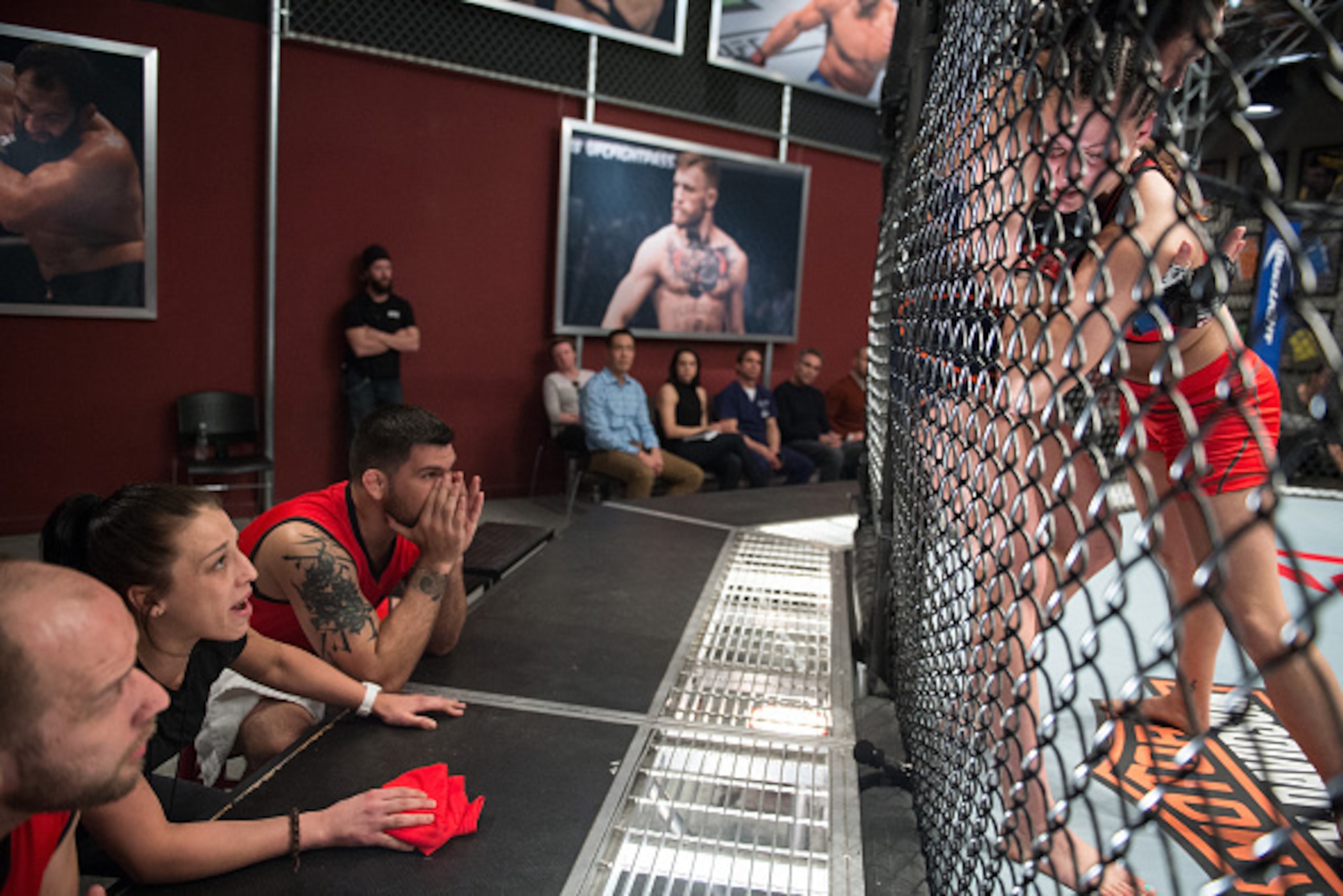 LAS VEGAS, NV - FEBRUARY 12:   Head coach Joanna Jedrzejczyk yells advice as Helen Harper pushes Lanchana Green up against the cage during the filming of The Ultimate Fighter: Team Joanna vs Team Claudia at the UFC TUF Gym on February 12, 2016 in Las Vega