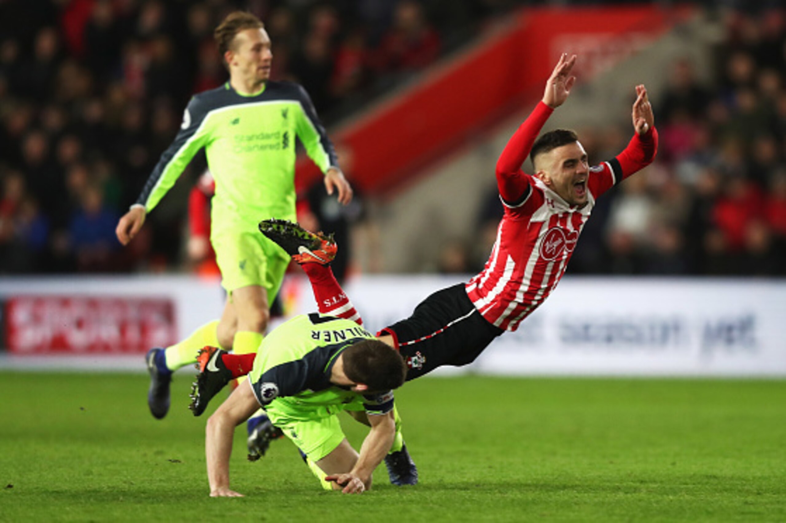 SOUTHAMPTON, ENGLAND - JANUARY 11: Dusan Tadic of Southampton is challenged by James Milner of Liverpool during the EFL Cup semi-final first leg match between Southampton and Liverpool at St Mary's Stadium on January 11, 2017 in Southampton, England. (P SOUTHAMPTON, ENGLAND - JANUARY 11: Dusan Tadic of Southampton is challenged by James Milner of Liverpool during the EFL Cup semi-final first leg match between Southampton and Liverpool at St Mary's Stadium on January 11, 2017 in Southampton, England. (P