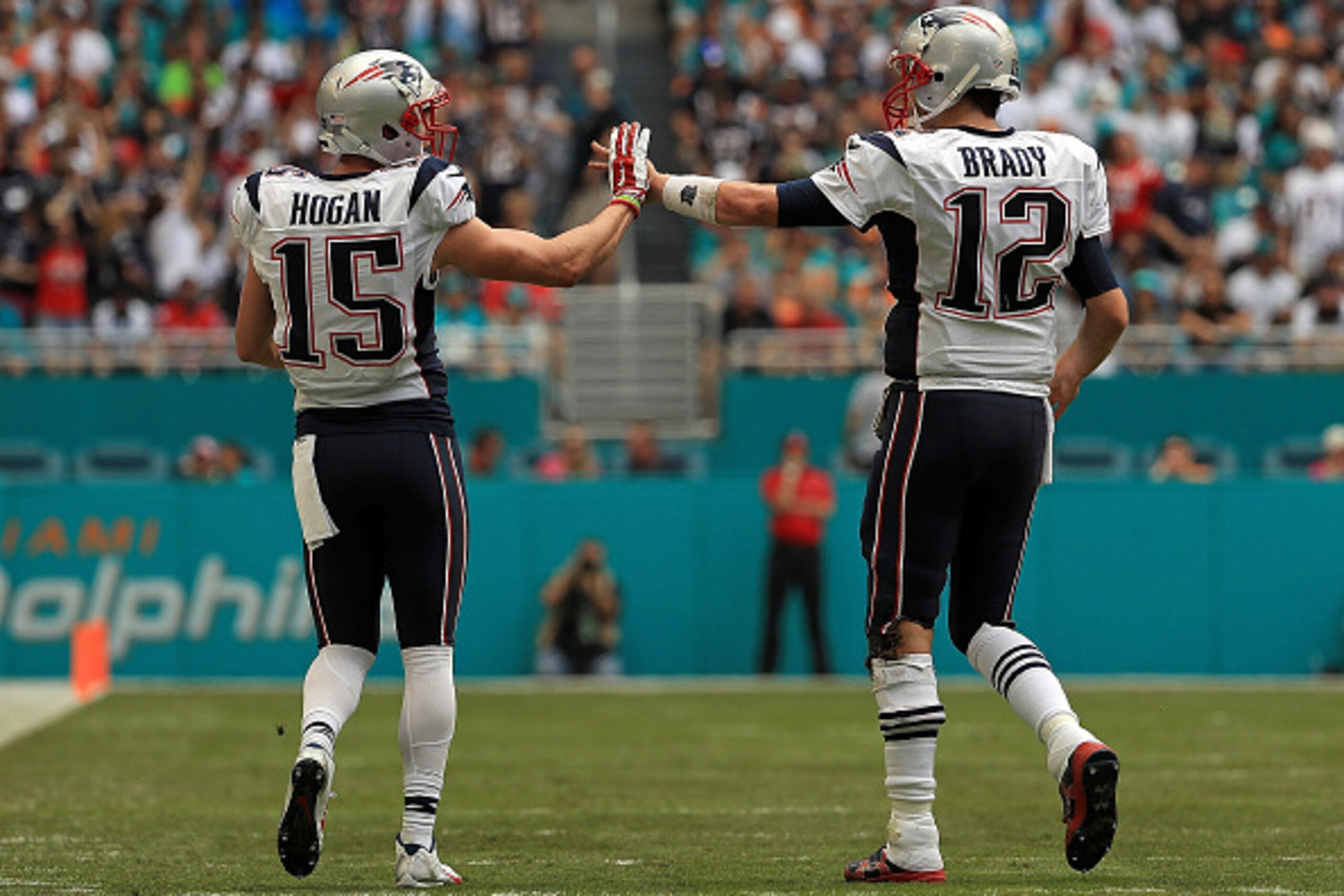 MIAMI GARDENS, FL - JANUARY 01: Tom Brady #12 and Chris Hogan #15 of the New England Patriots celebrate a touchdown during a game against the Miami Dolphins at Hard Rock Stadium on January 1, 2017 in Miami Gardens, Florida. (Photo by Mike Ehrmann/Getty I MIAMI GARDENS, FL - JANUARY 01: Tom Brady #12 and Chris Hogan #15 of the New England Patriots celebrate a touchdown during a game against the Miami Dolphins at Hard Rock Stadium on January 1, 2017 in Miami Gardens, Florida. (Photo by Mike Ehrmann/Getty I