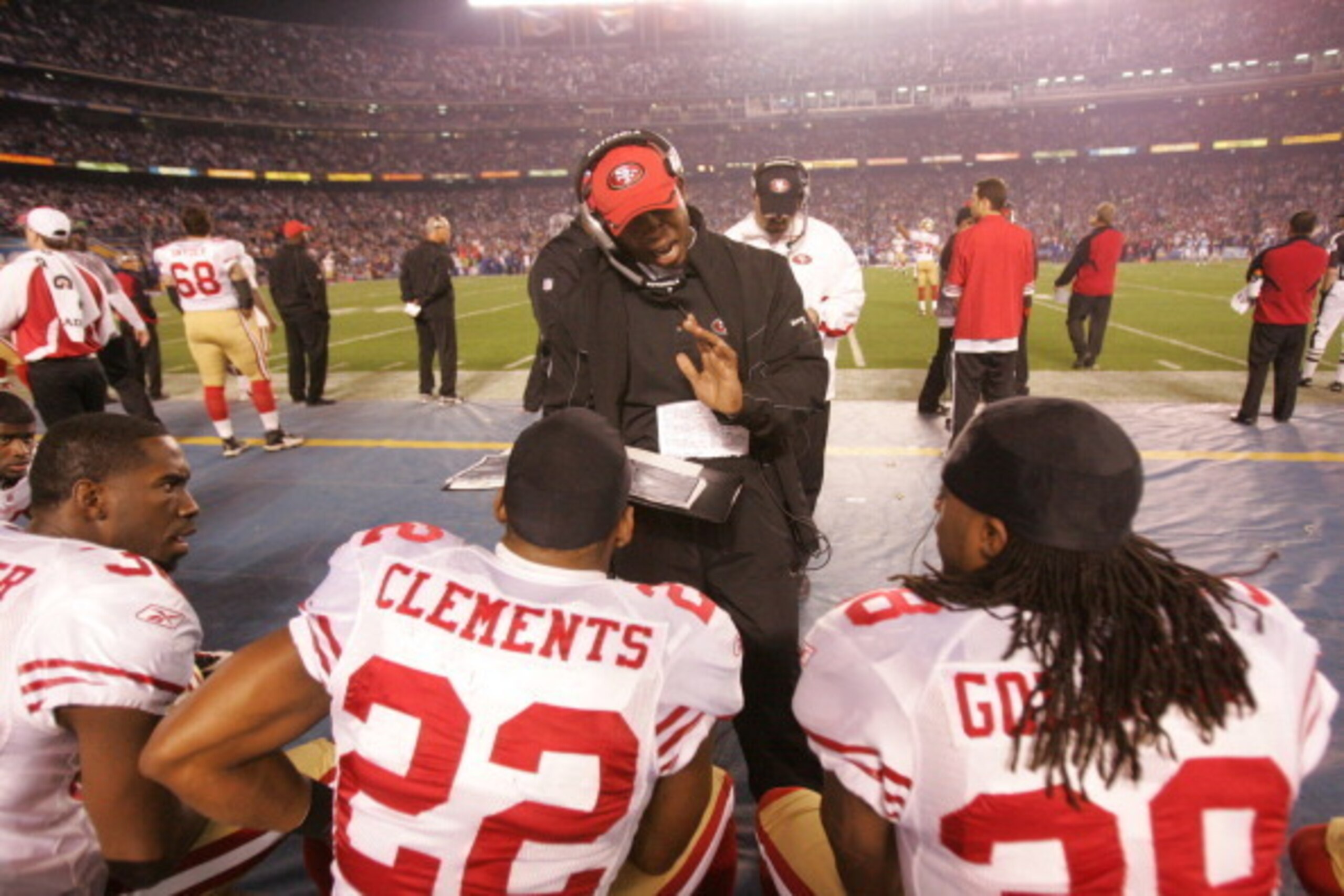 SAN DIEGO, CA - DECEMBER 16: Secondary Coach Vance Joseph of the San Francisco 49ers talks with Shawntae Spencer #36, Nate Clements #22 and Dashon Goldson #38 during the game against the San Diego Chargers at Qualcomm Stadium on December 16, 2010 in San D