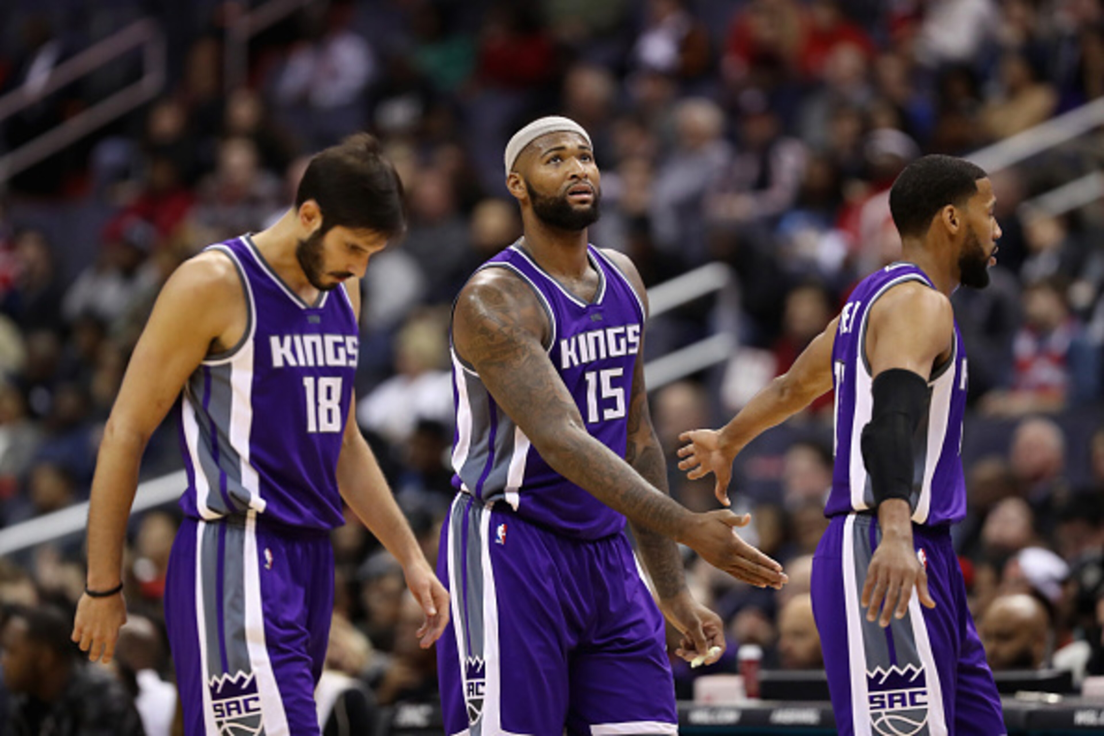 WASHINGTON, DC - NOVEMBER 28: Omri Casspi #18, DeMarcus Cousins #15 and Garrett Temple #17 of the Sacramento Kings walk off the floor during a timeout against the Washington Wizards at Verizon Center on November 28, 2016 in Washington, DC. NOTE TO USER: U