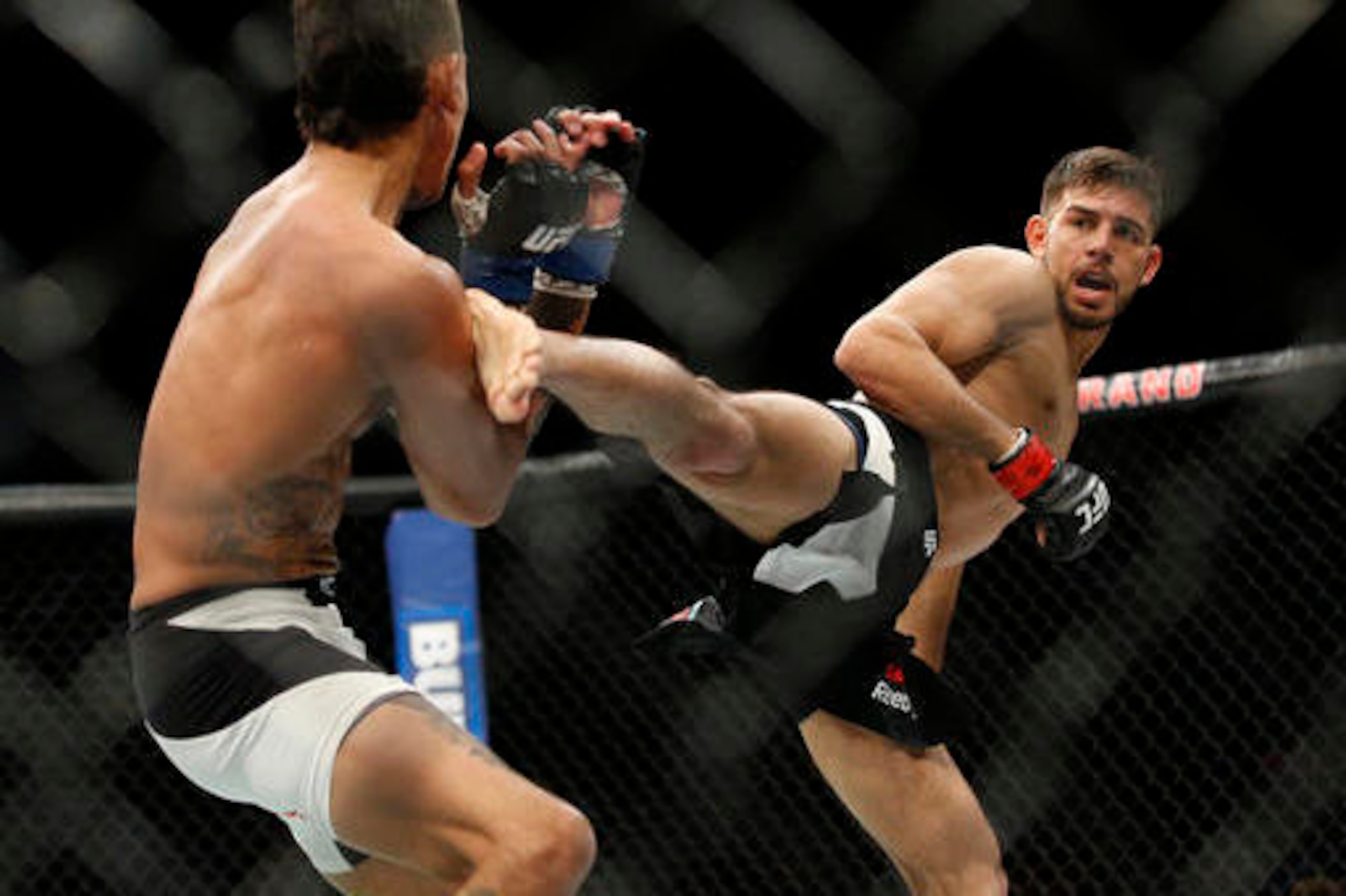 Rodriguez throws a kick at UFC 197.