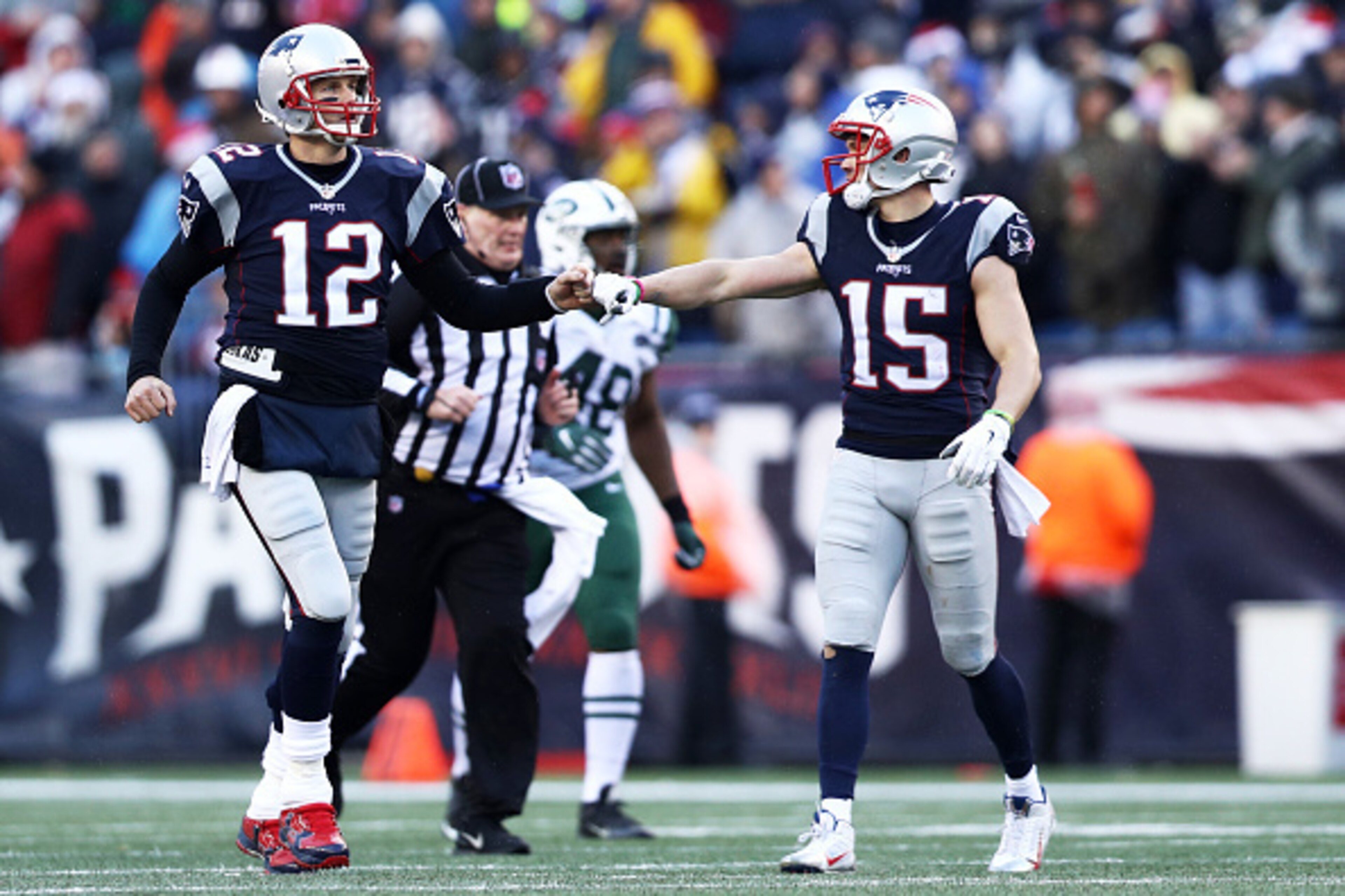 FOXBORO, MA - DECEMBER 24: Tom Brady #12 of the New England Patriots reacts with Chris Hogan #15 during the first half against the New York Jets at Gillette Stadium on December 24, 2016 in Foxboro, Massachusetts. (Photo by Maddie Meyer/Getty Images)