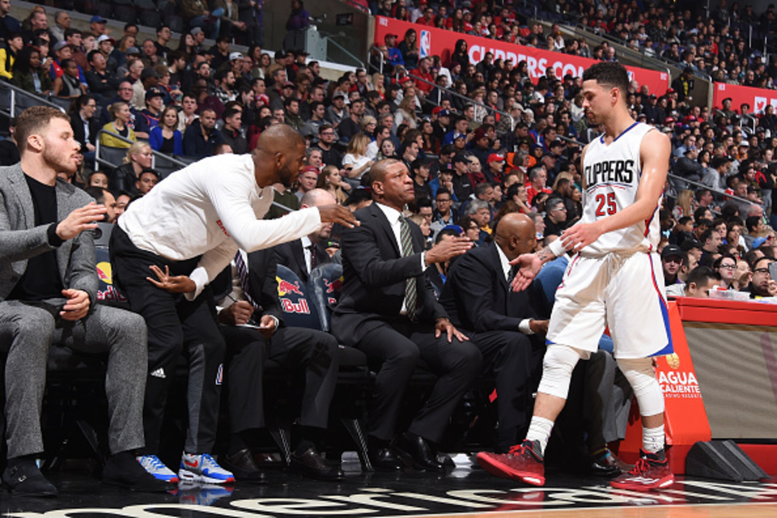 LOS ANGELES, CA - JANUARY 2:  Head Coach Doc Rivers and Austin Rivers #25 of the LA Clippers converse during the game against the Phoenix Suns on January 2, 2017 at STAPLES Center in Los Angeles, California. NOTE TO USER: User expressly acknowledges and a