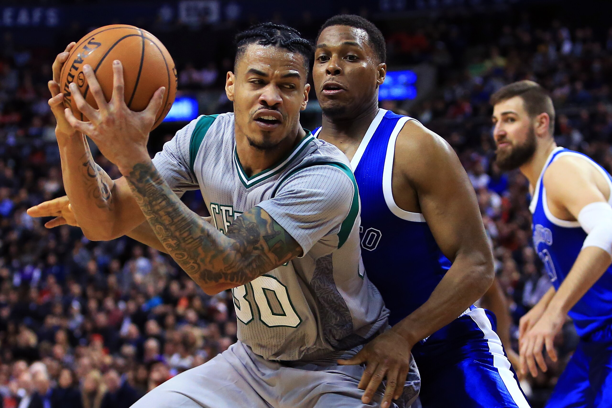 TORONTO, ON - JANUARY 10:  Gerald Green #30 of the Boston Celtics dribbles the ball as Kyle Lowry #7 of the Toronto Raptors defends during the second half of an NBA game at Air Canada Centre on January 10, 2017 in Toronto, Canada.  NOTE TO USER: User expr