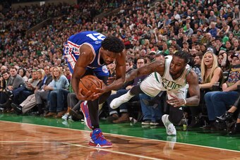 BOSTON, MA - JANUARY 6:  Jae Crowder #99 of the Boston Celtics and Joel Embiid #21 of the Philadelphia 76ers fight for posession of the ball on January 6, 2017 at TD Garden in Boston, Massachusetts.  NOTE TO USER: User expressly acknowledges and agrees th