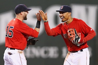 BOSTON, MA - SEPTEMBER 16: Mookie Betts #50 of the Boston Red Sox and Dustin Pedroia #15 celebrate their 7-4 win over the New York Yankees at Fenway Park on September 16, 2016 in Boston, Massachusetts.  (Photo by Maddie Meyer/Getty Images)