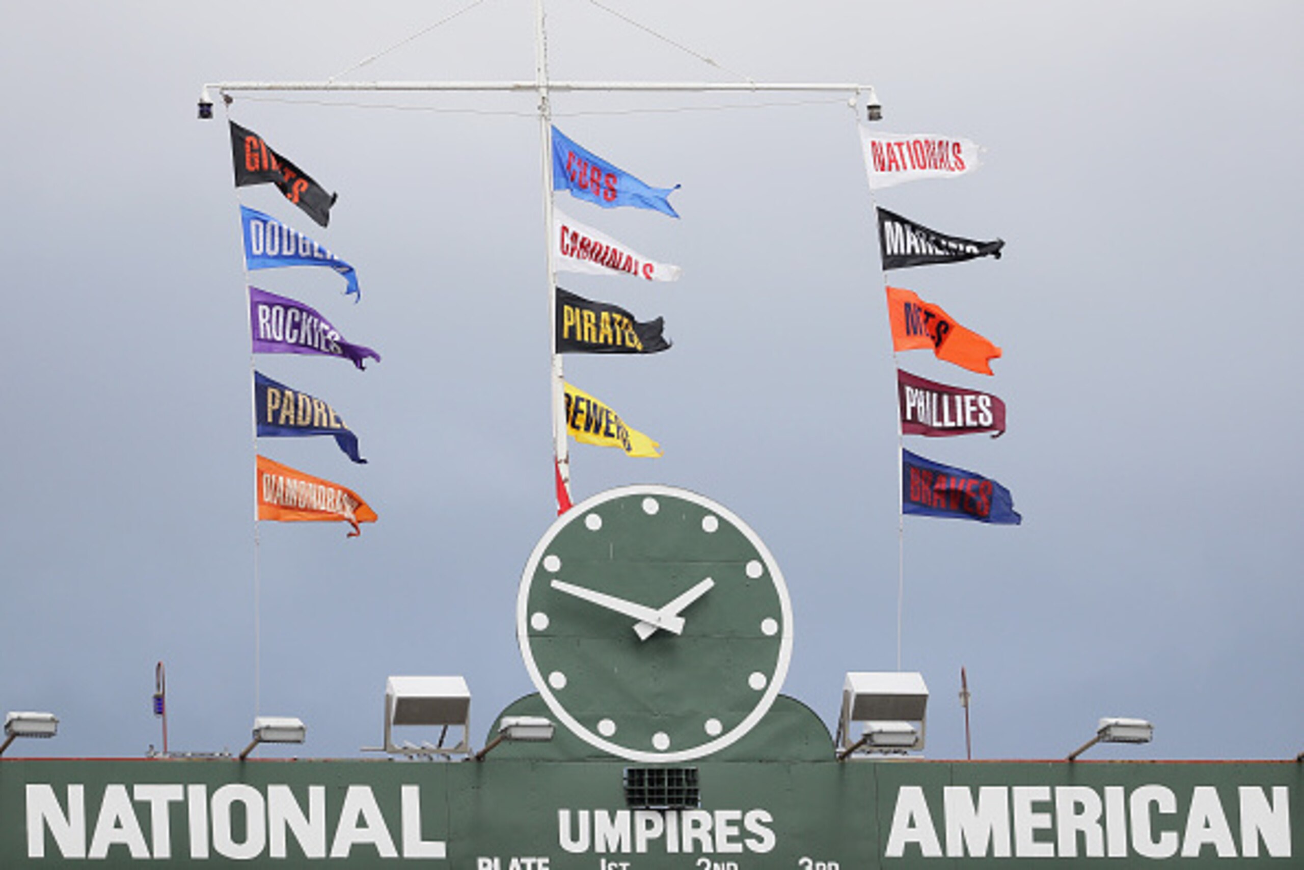 CHICAGO, IL - AUGUST 13: Flags fly above the scoreboard at Wrigley Field during a game between the Chicasgo Cubs and the St. Louis Cardinals on August 13, 2016 in Chicago, Illinois. (Photo by Jonathan Daniel/Getty Images)