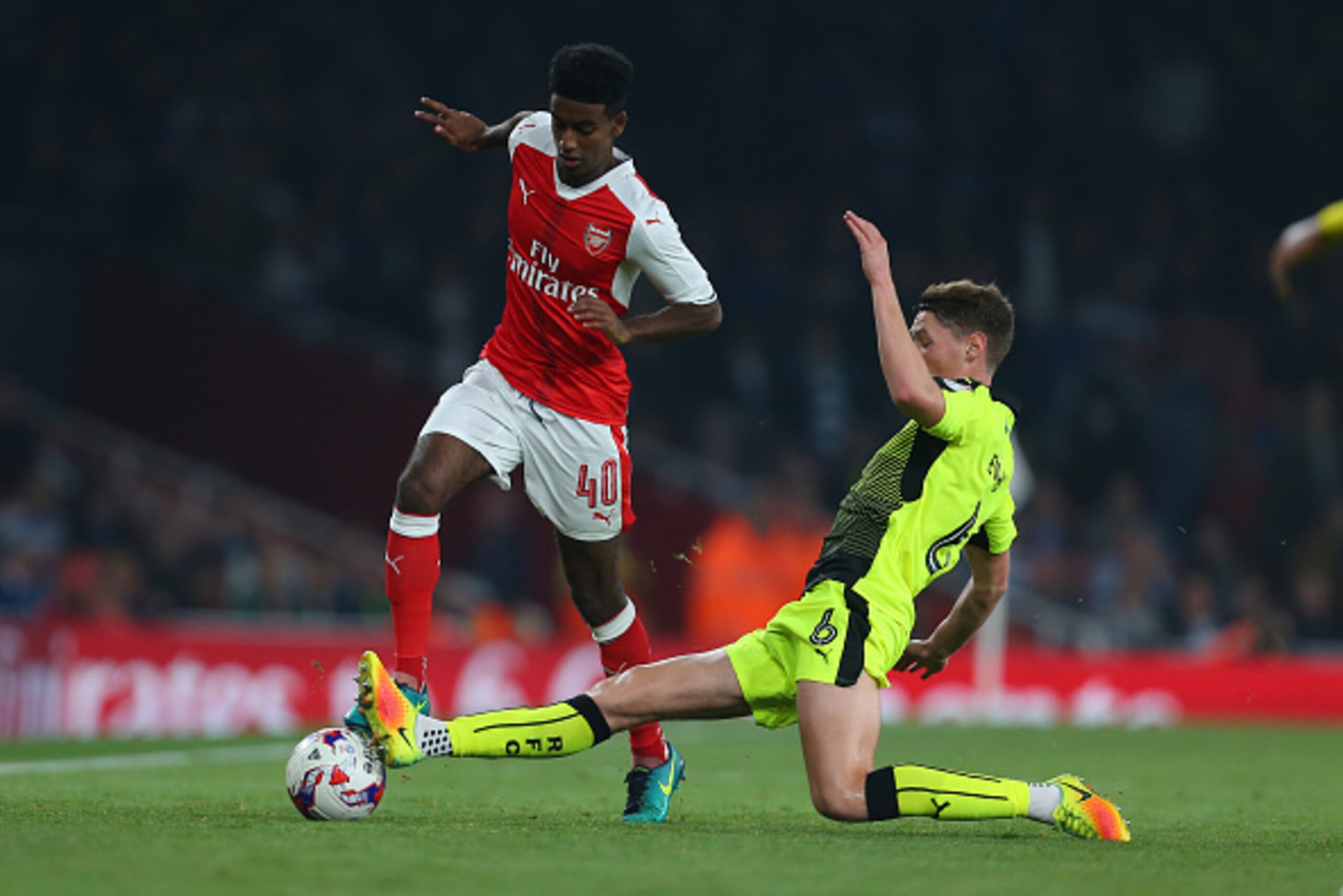 LONDON, ENGLAND - OCTOBER 25: Gedion Zelalem of Arsenal is tackled by George Evans of Reading during the EFL Cup fourth round match between Arsenal and Reading at Emirates Stadium on October 25, 2016 in London, England. (Photo by Catherine Ivill - AMA/Get
