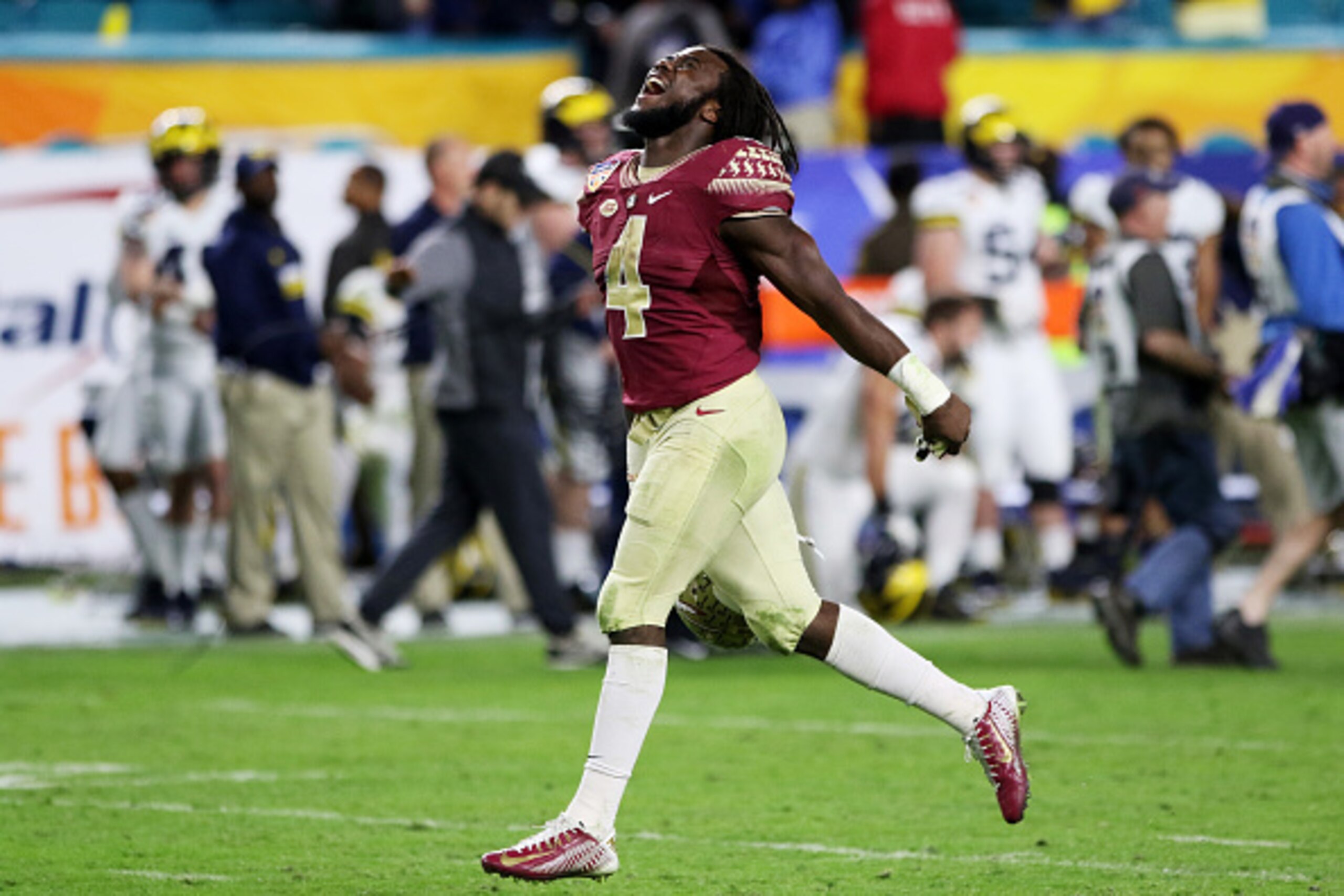 MIAMI GARDENS, FL - DECEMBER 30:  MVP Dalvin Cook #4 of the Florida State Seminoles celebrates their 33 to 32 win over the Michigan Wolverines during the Capitol One Orange Bowl at Sun Life Stadium on December 30, 2016 in Miami Gardens, Florida.  (Photo b