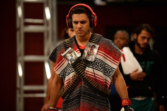 LAS VEGAS, NV - JUNE 18:  Team Velasquez fighter Yair Rodriguez prepares to enter the Octagon before facing team Velasquez fighter Rodolfo Rubio in their semifinal fight during filming of The Ultimate Fighter Latin America on June 18, 2014 in Las Vegas, N