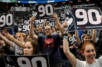 UConn fans celebrate their team's record-tying win on Tuesday.
