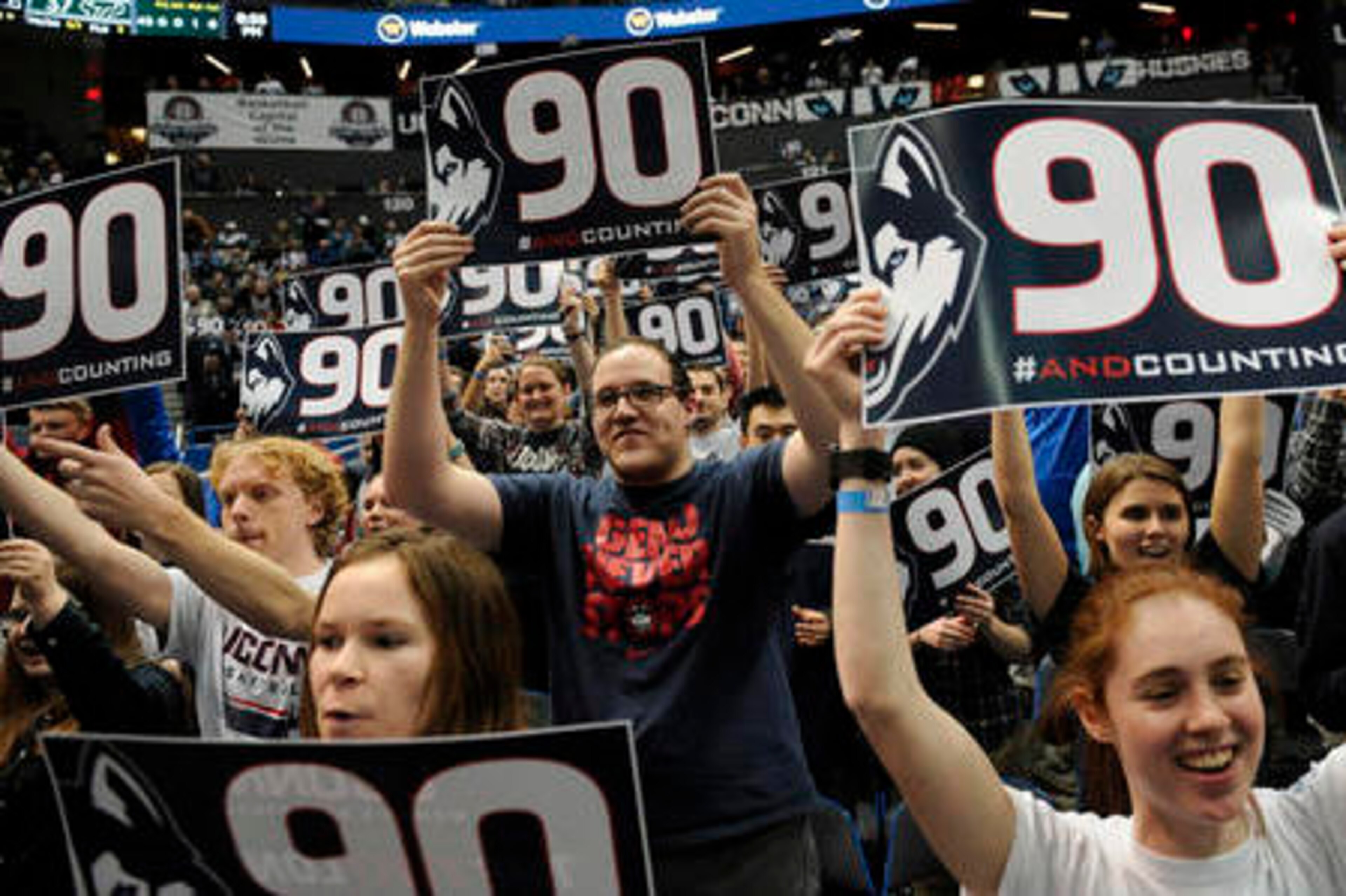 UConn fans celebrate their team's record-tying win on Tuesday.