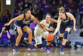 MANHATTAN, KS - DECEMBER 11:  Forward Kaylee Page #1 of the Kansas State Wildcats reaches for a loose ball with players Katie Samuelson #33 and Napheesa Collier #24 of the Connecticut Huskies during the second half on December 11, 2016 at Bramlage Coliseu