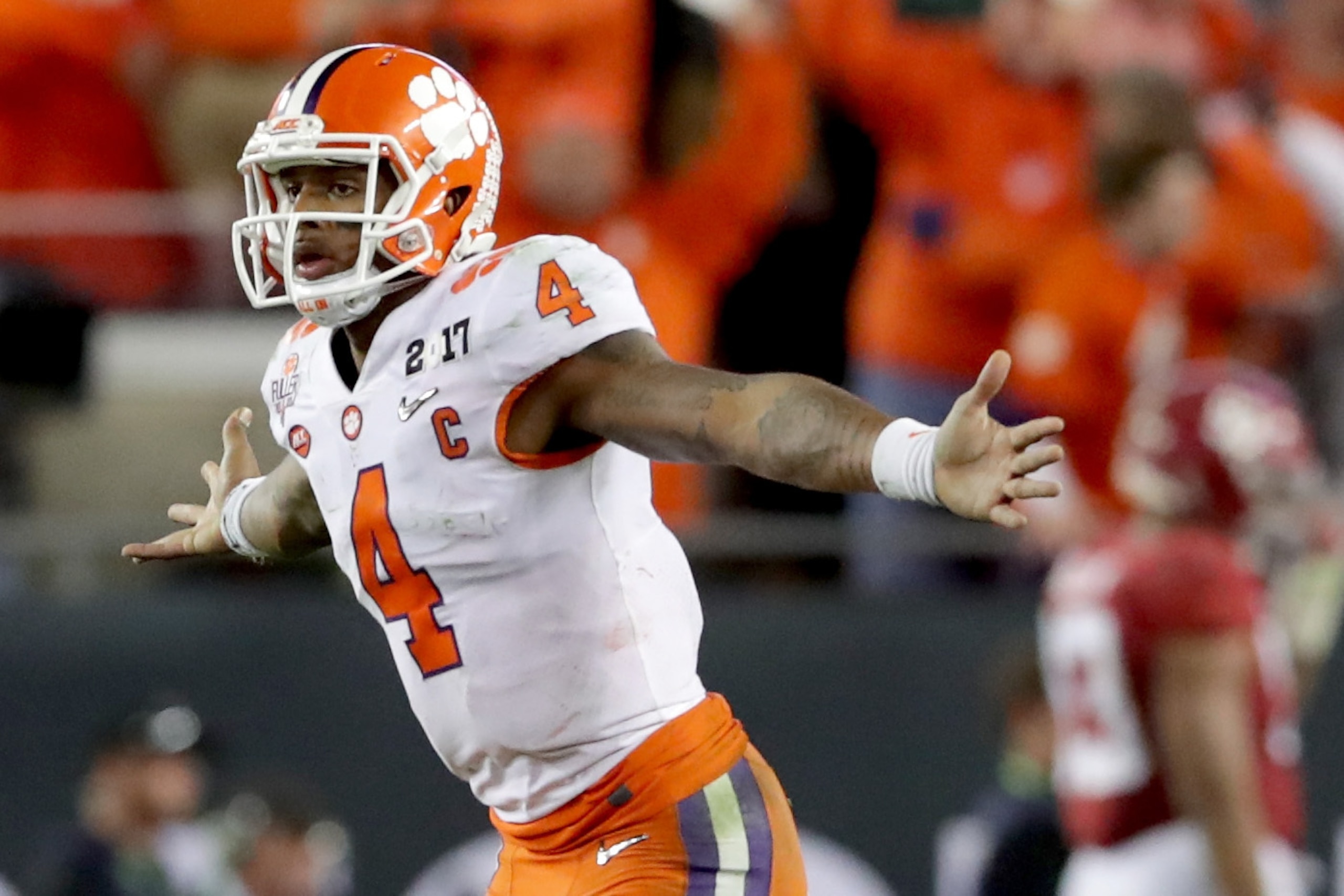 TAMPA, FL - JANUARY 09: Quarterback Deshaun Watson #4 of the Clemson Tigers celebrates after throwing a 2-yard game-winning touchdown pass during the fourth quarter against the Alabama Crimson Tide to win the 2017 College Football Playoff National Champi TAMPA, FL - JANUARY 09: Quarterback Deshaun Watson #4 of the Clemson Tigers celebrates after throwing a 2-yard game-winning touchdown pass during the fourth quarter against the Alabama Crimson Tide to win the 2017 College Football Playoff National Champi